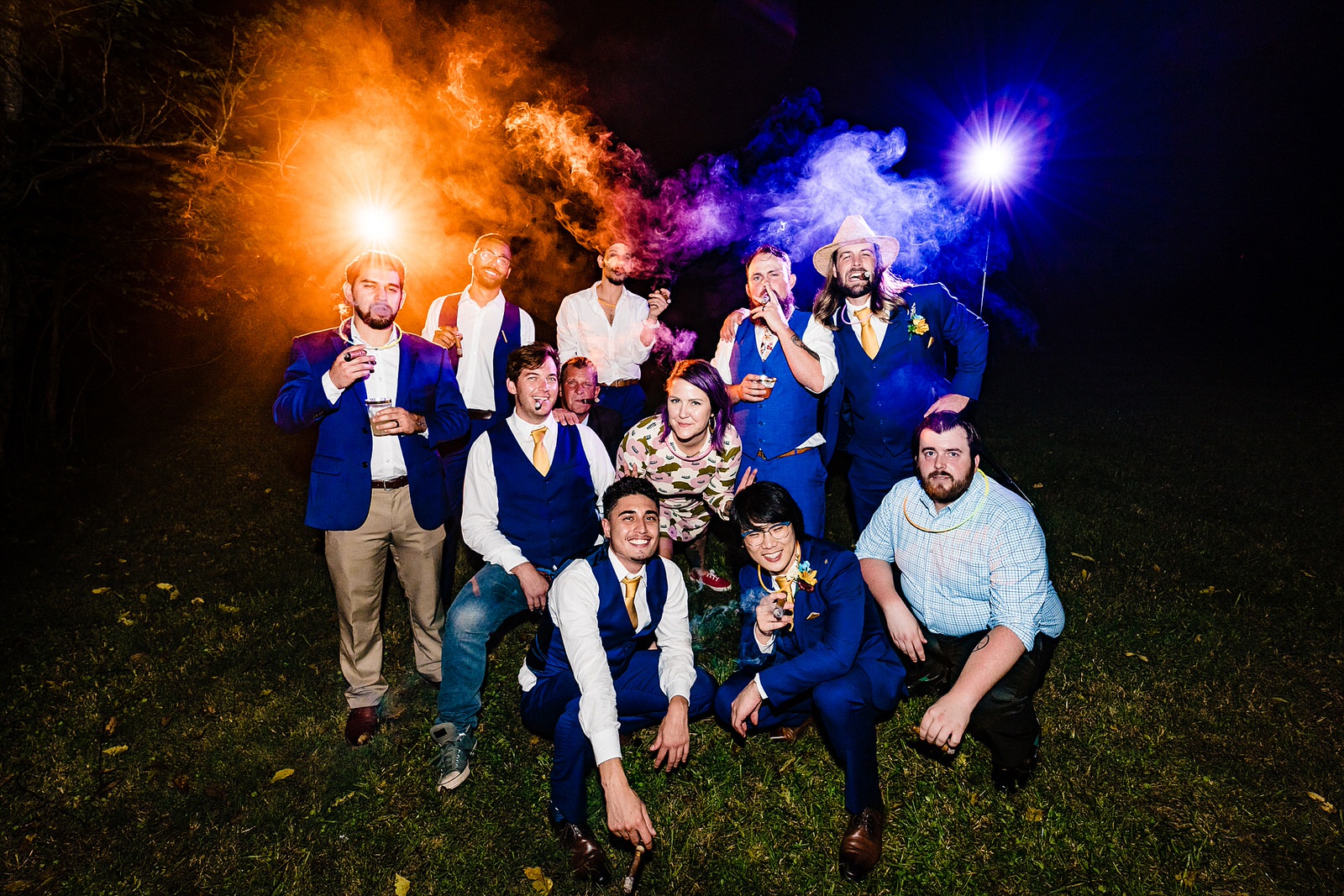 Groom and his friends enjoy a cigar at the wedding reception