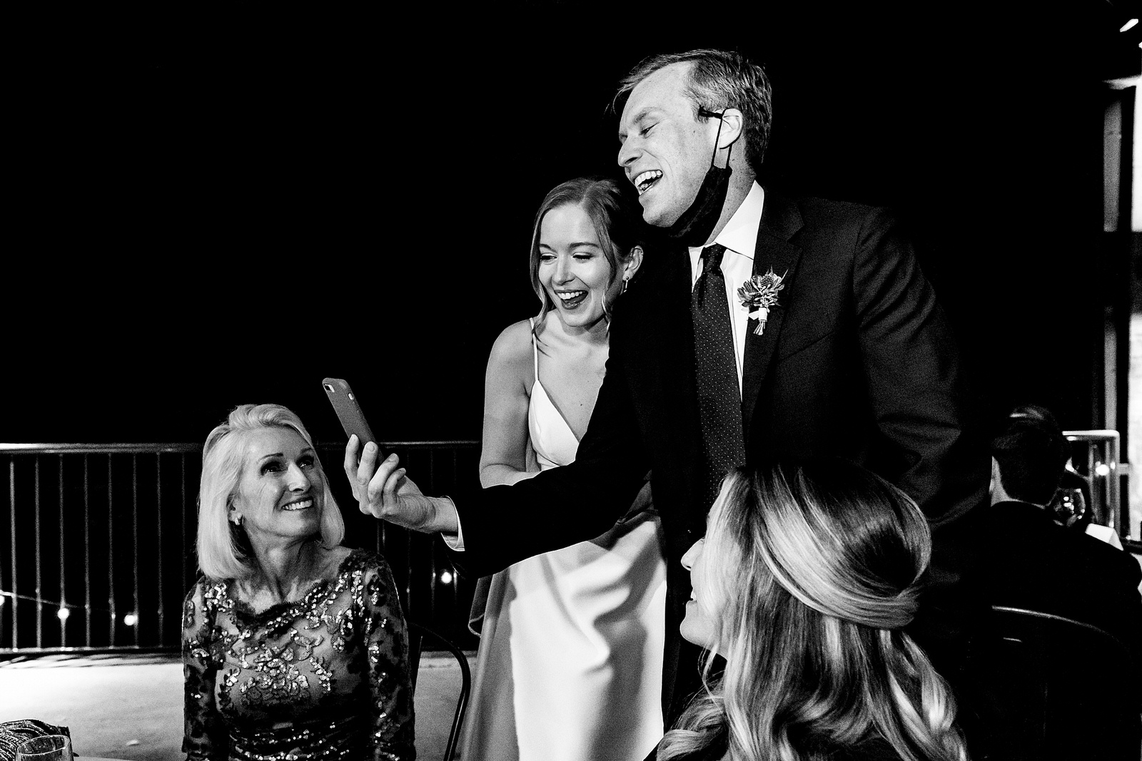 newlyweds facetime with friends during their wedding reception after having to downsize due to Covid19