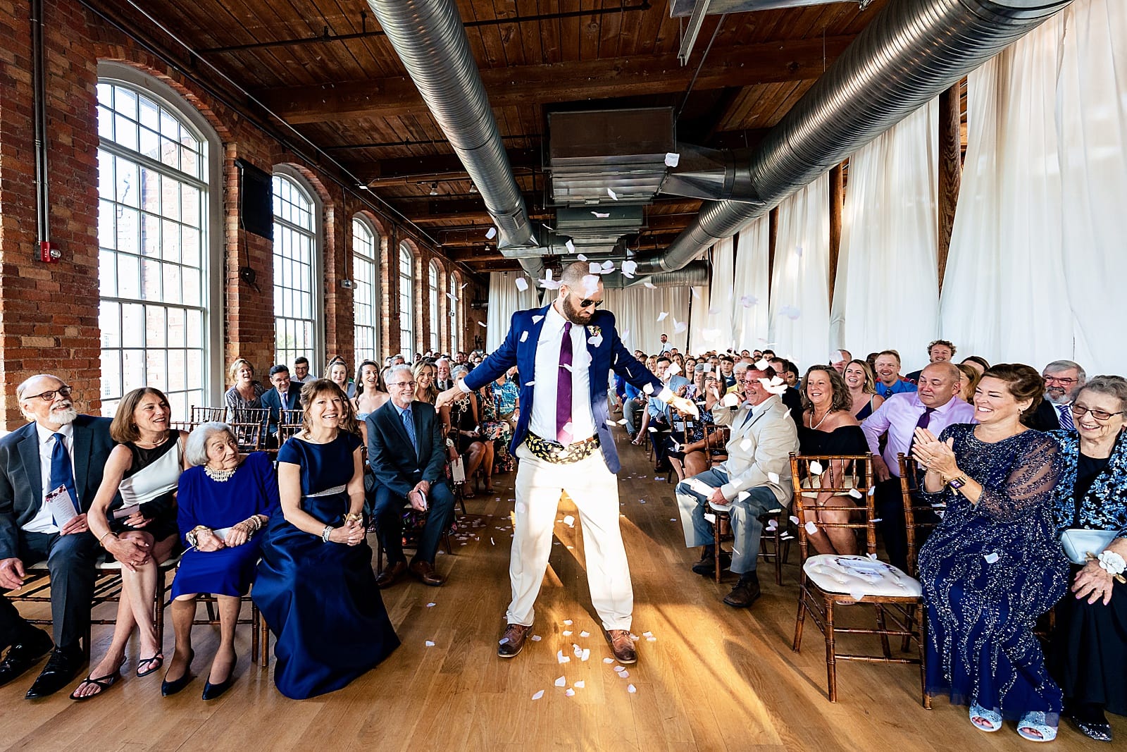 This couple had one of their friends as the "Flower Man". He had a fanny pack full of petals and tossed them very dramatically as he made his way down the aisle. SUCH a fun wedding