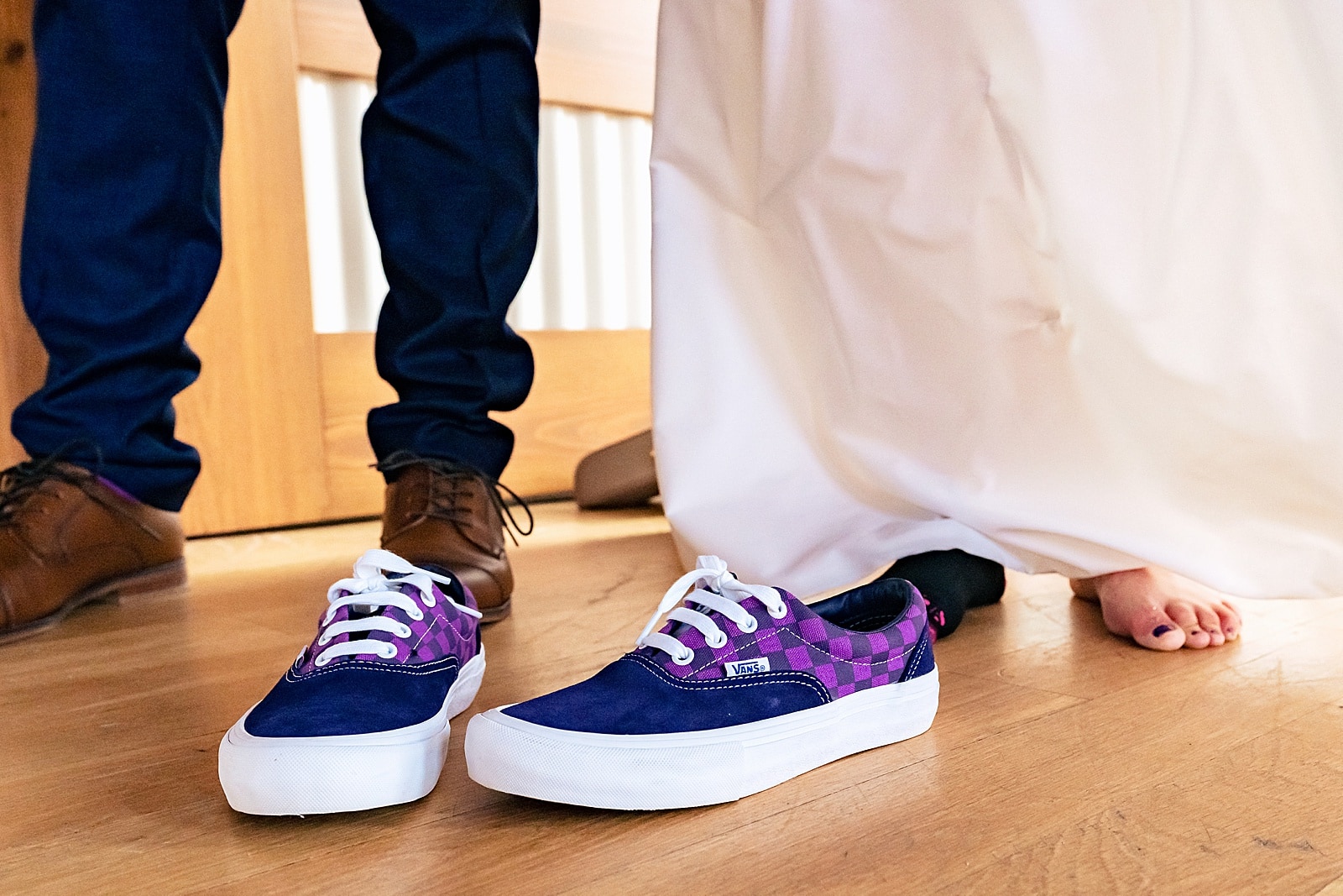 You should definitely consider changing into some flats for your wedding reception. And if those flats are purple vans? Hell yeah. 