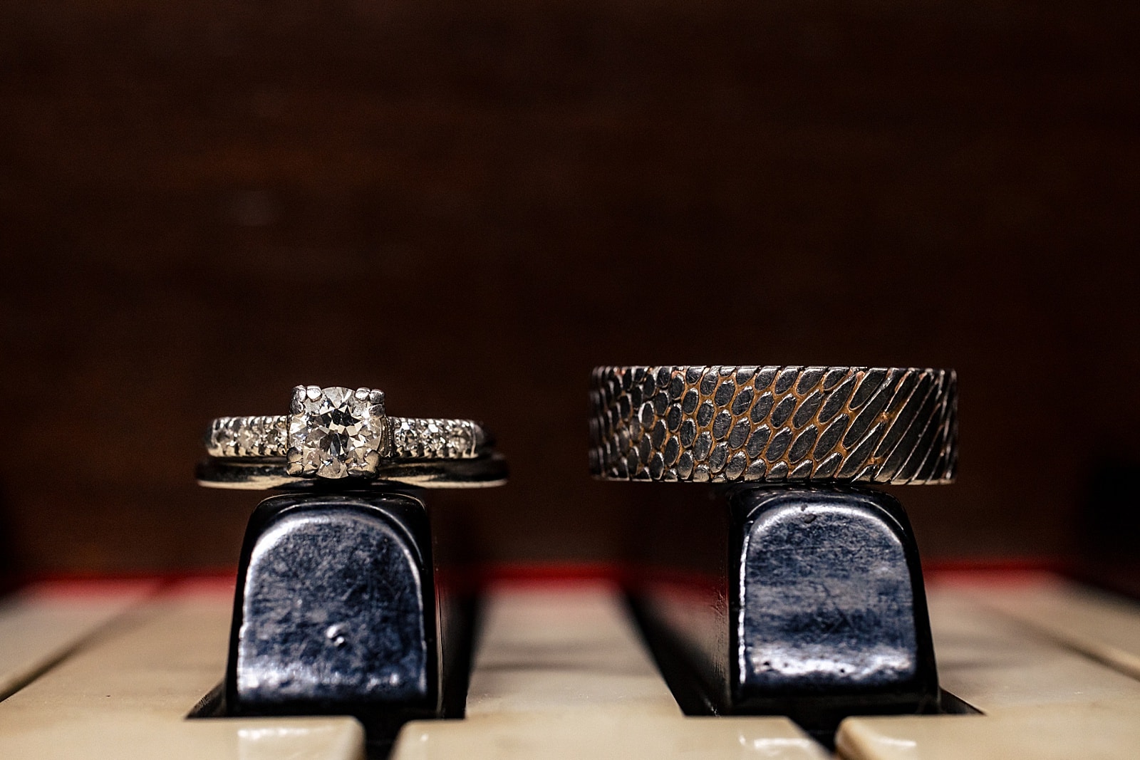 wedding rings on a piano
