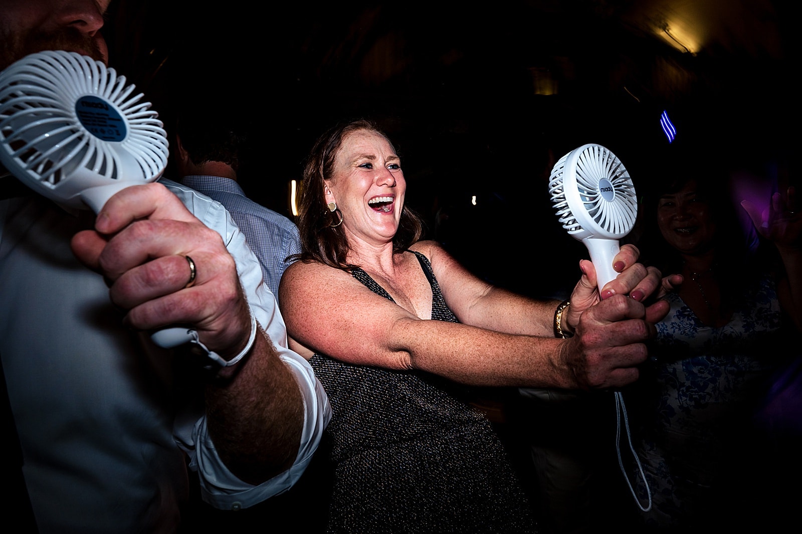 summer wedding? consider having some portable fans for your guests