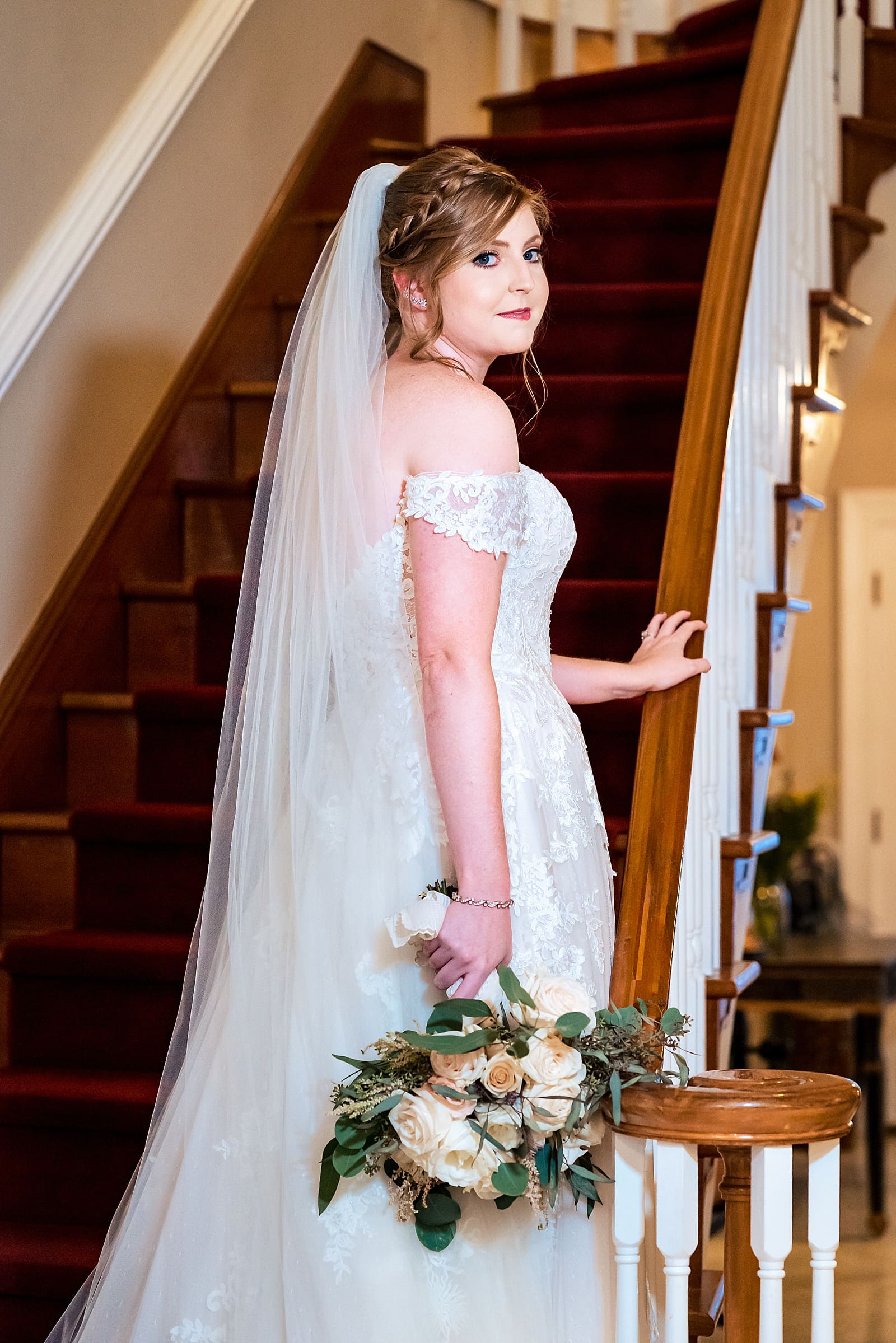 Bridal portraits on the stairs at The Matthews House in Cary, NC