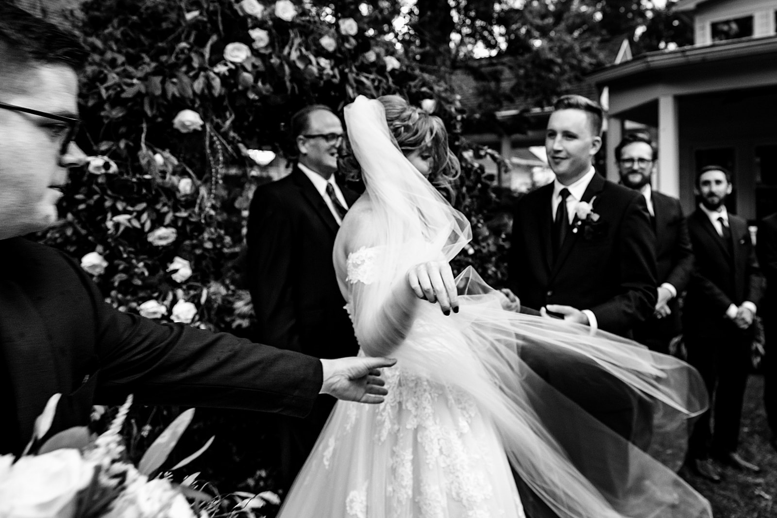 wind tries to take control of bride's veil at this wedding ceremony