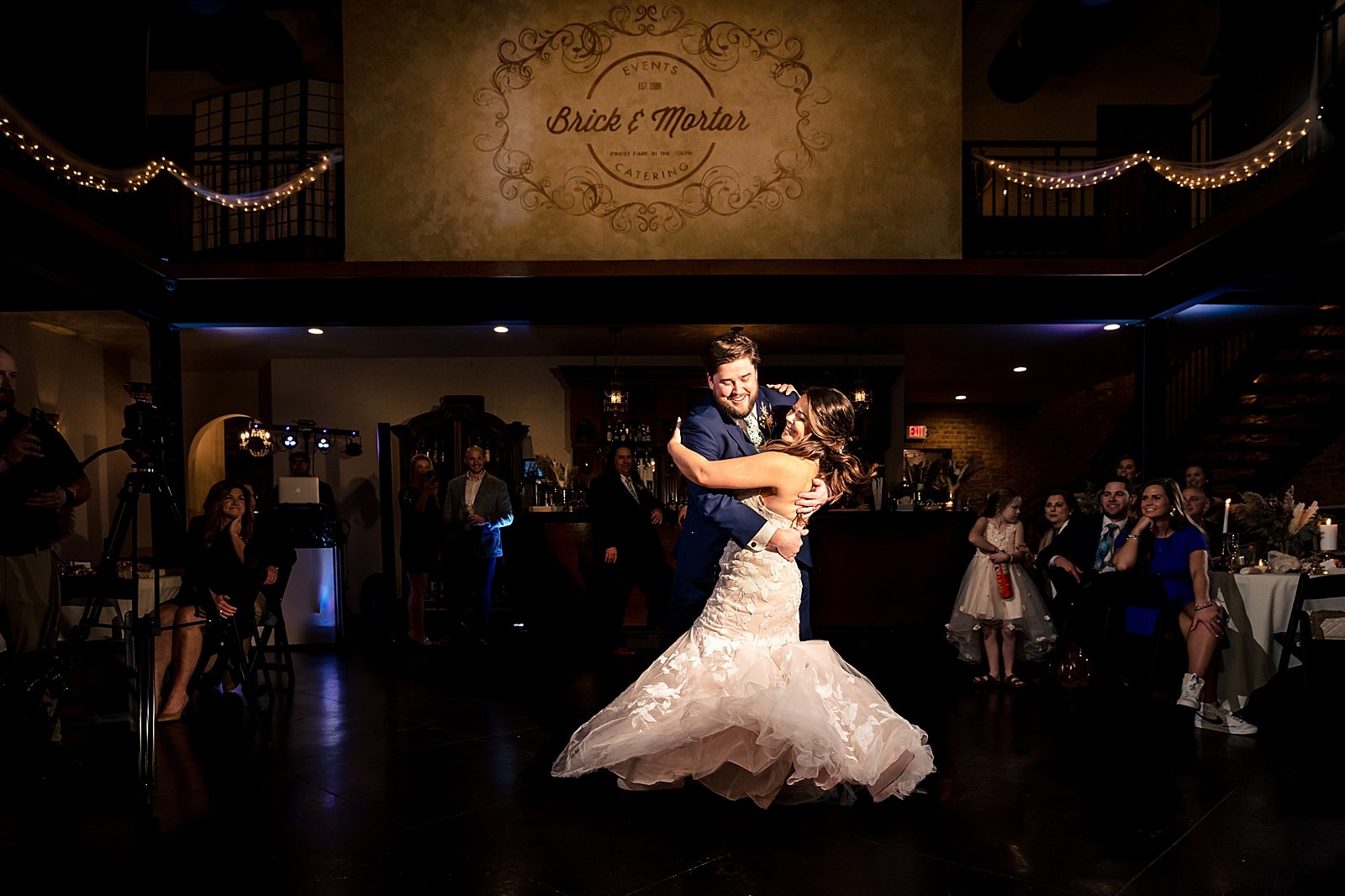 First dance twirl at Brick & Mortar Events wedding in Clayton, NC