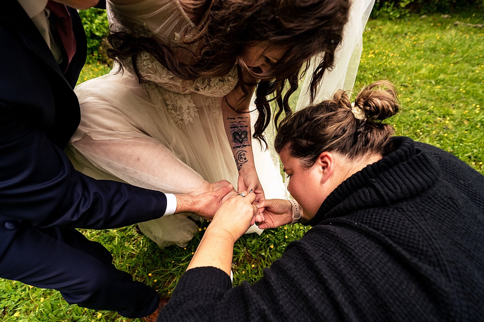 This bride got a splinter, but her partner and wedding planner were on hand to save her poor foot!!