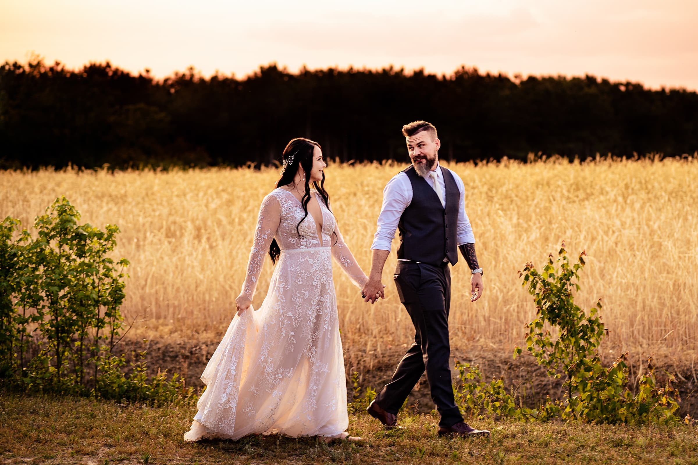 newlywed happiness during portraits immediately after the ceremony at this vineyard wedding