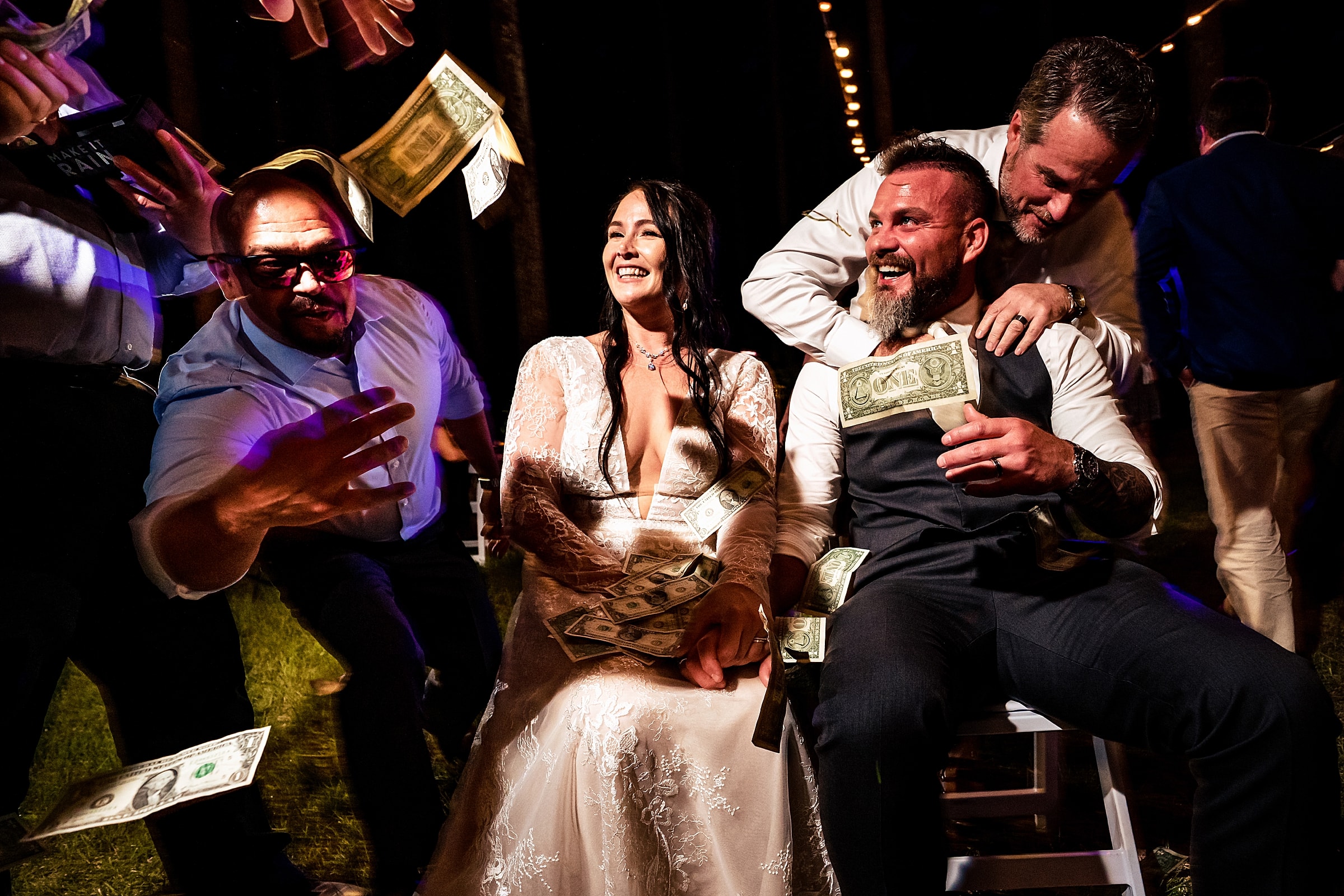 This groom's co-workers surprised the couple by making it rain dollar bills on them