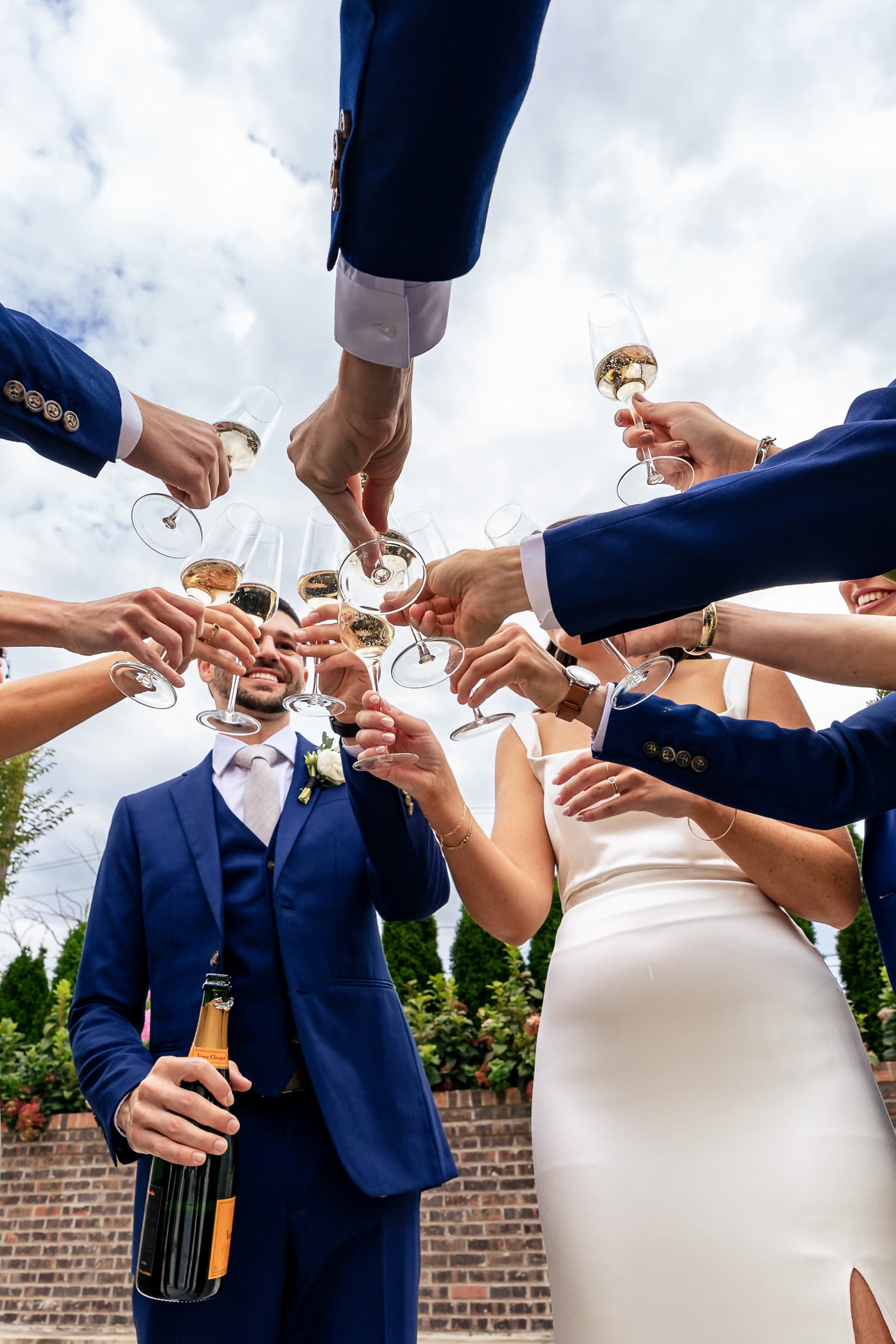 bride and groom share a champagne toast w/ their wedding party | photos by Kivus & Camera