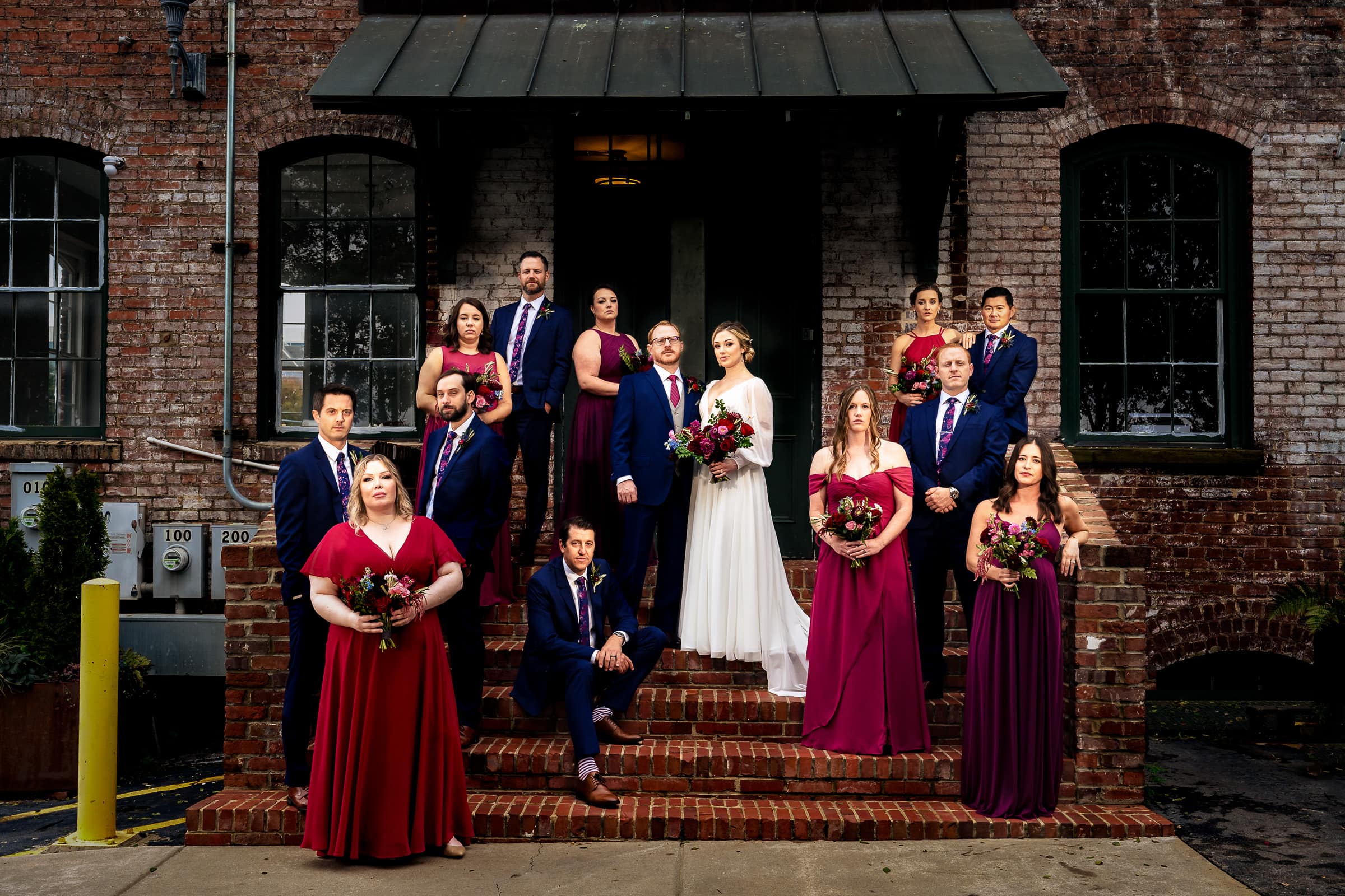 dramatic wedding party portrait at Melrose Knitting Mill | photos by Kivus & Camera