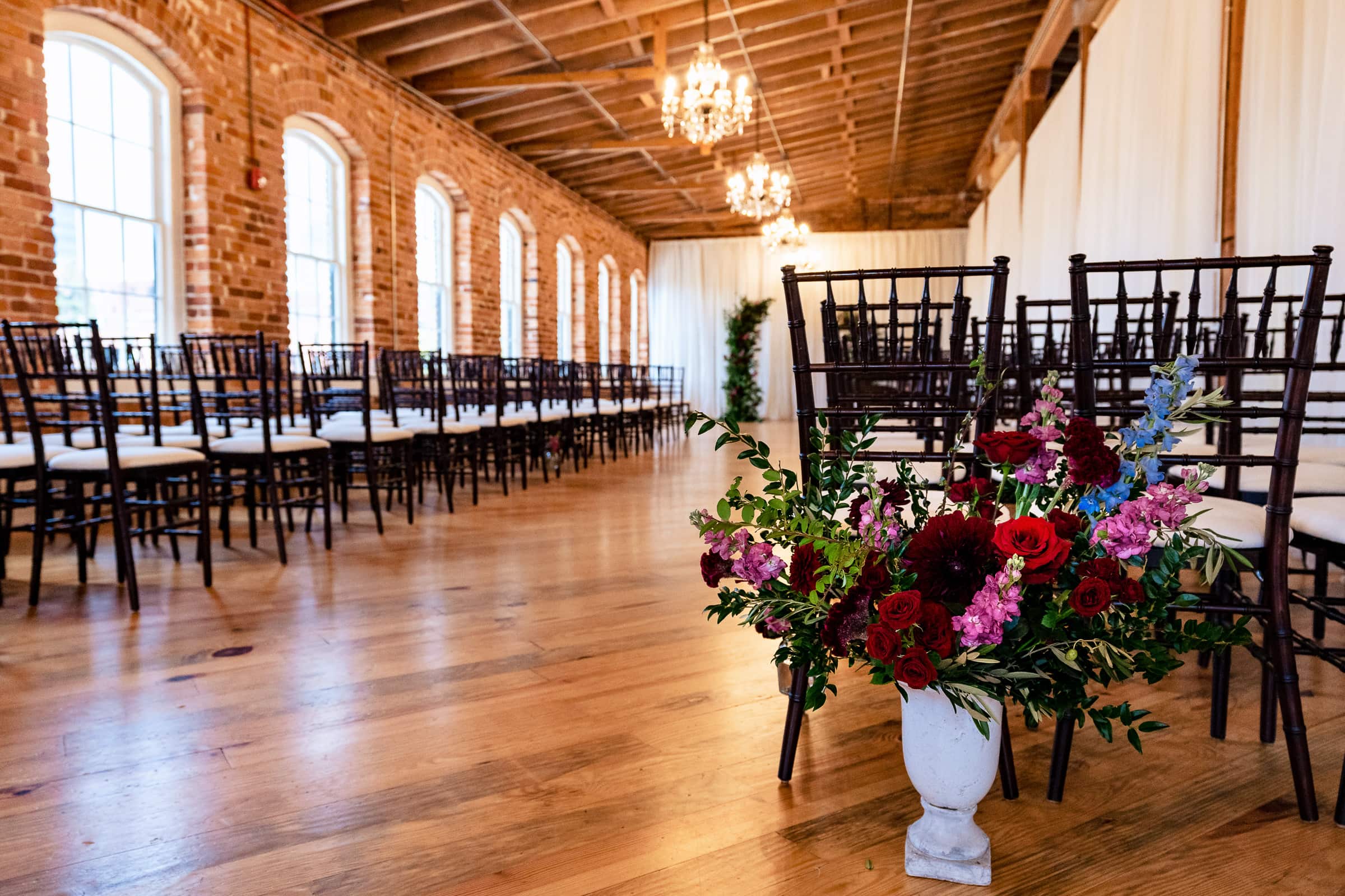 Historic Raleigh Venue Melrose Knitting Mill set up for a wedding ceremony | photos by Kivus & Camera