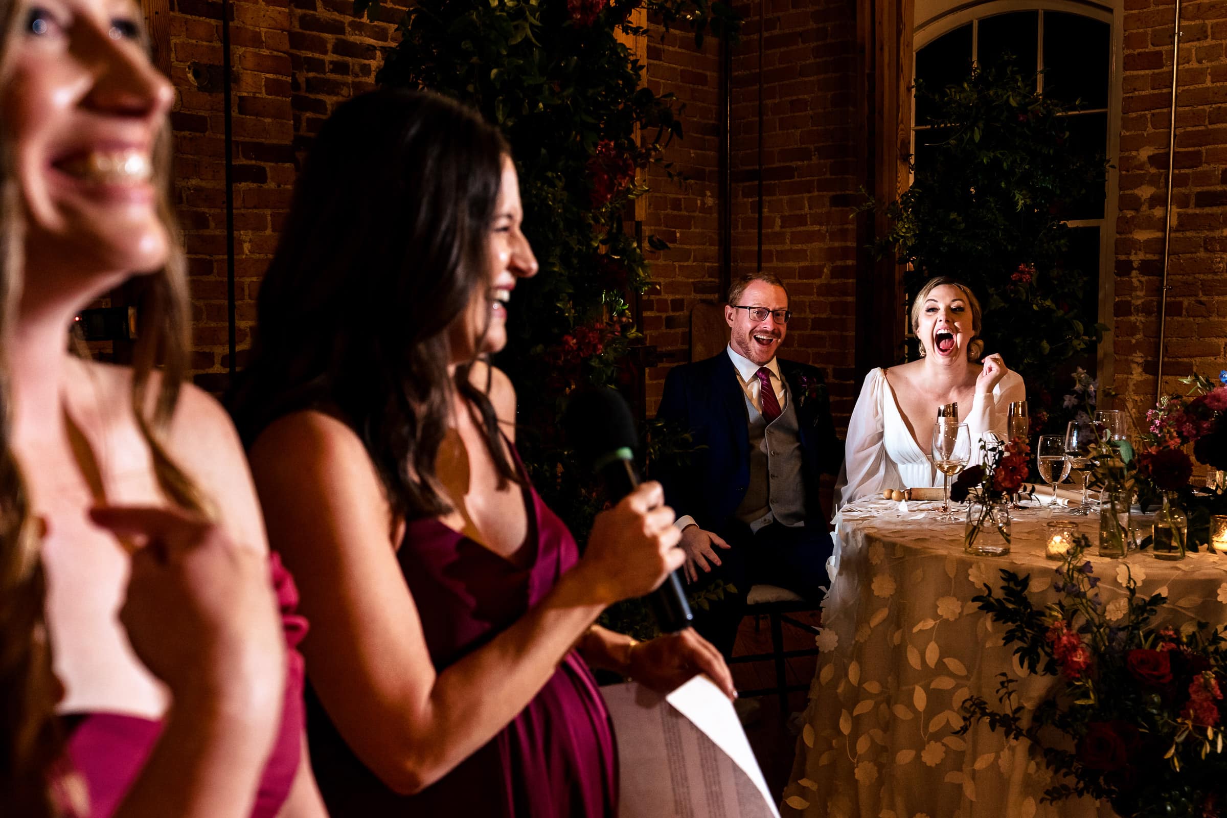 newlyweds react to a friend's toast at their historic Raleigh venue wedding | photos by Kivus & Camera