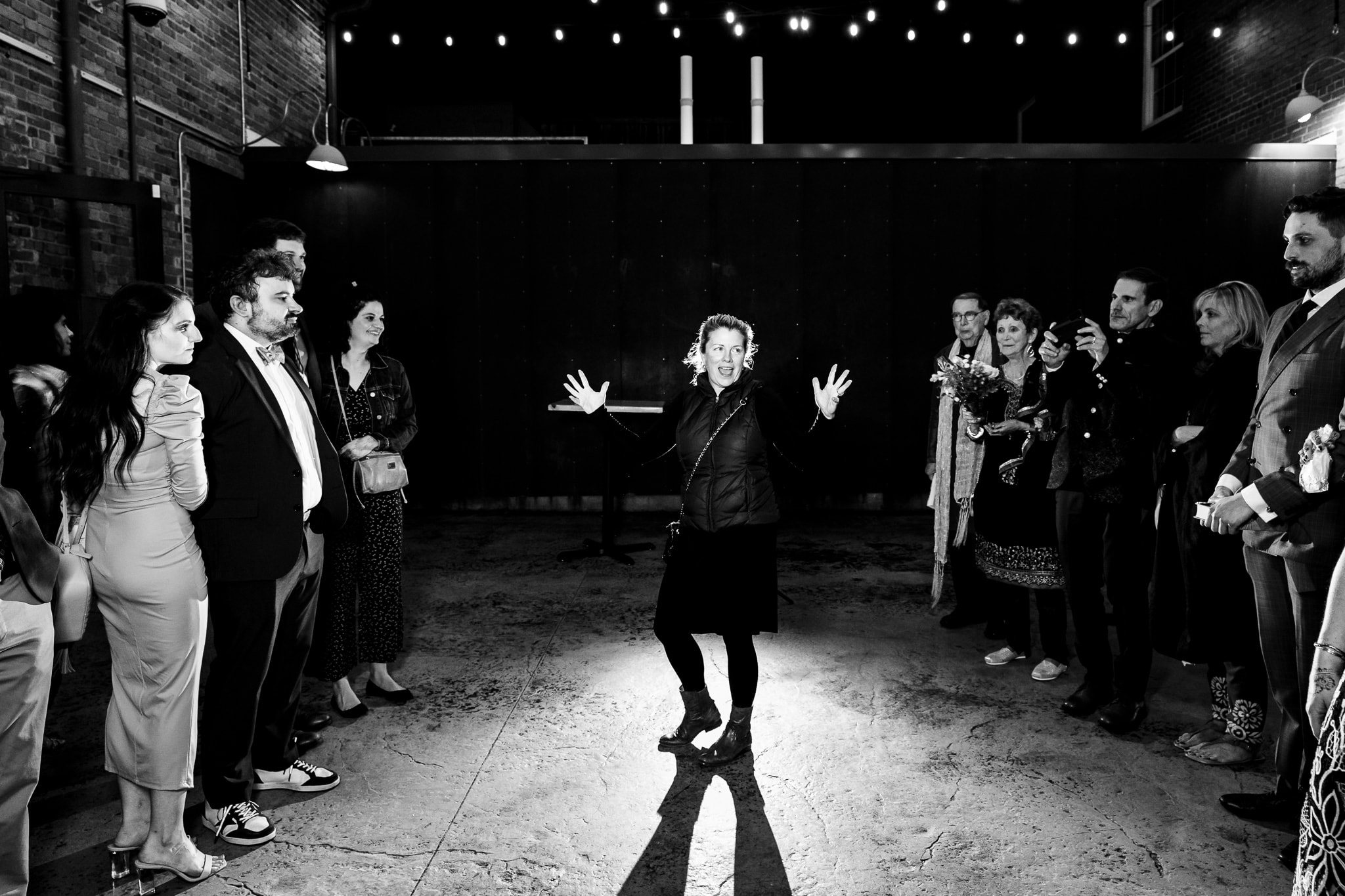 Amanda from A Swanky Affair instructs wedding guests before a sparkler exit. A Swanky Affair is one of the best NCWedding Planners. | photo by Kivus & Camera