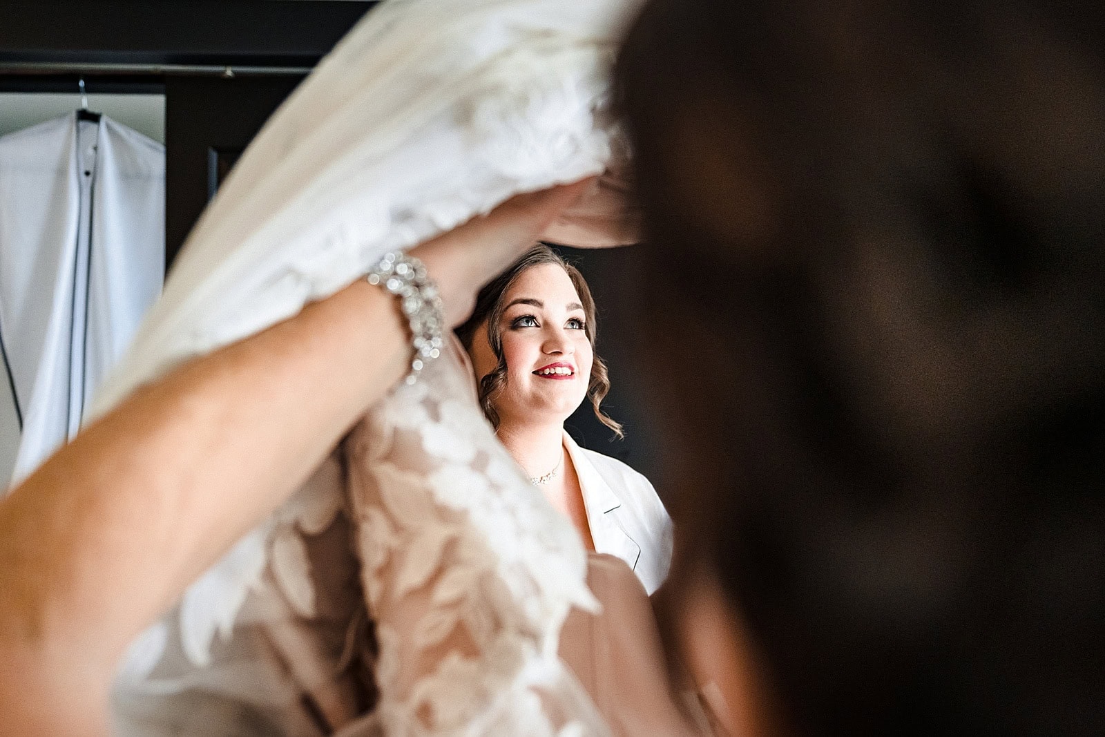Soak in every moment of your wedding day, even the little ones like taking off your pjs to put on your dress