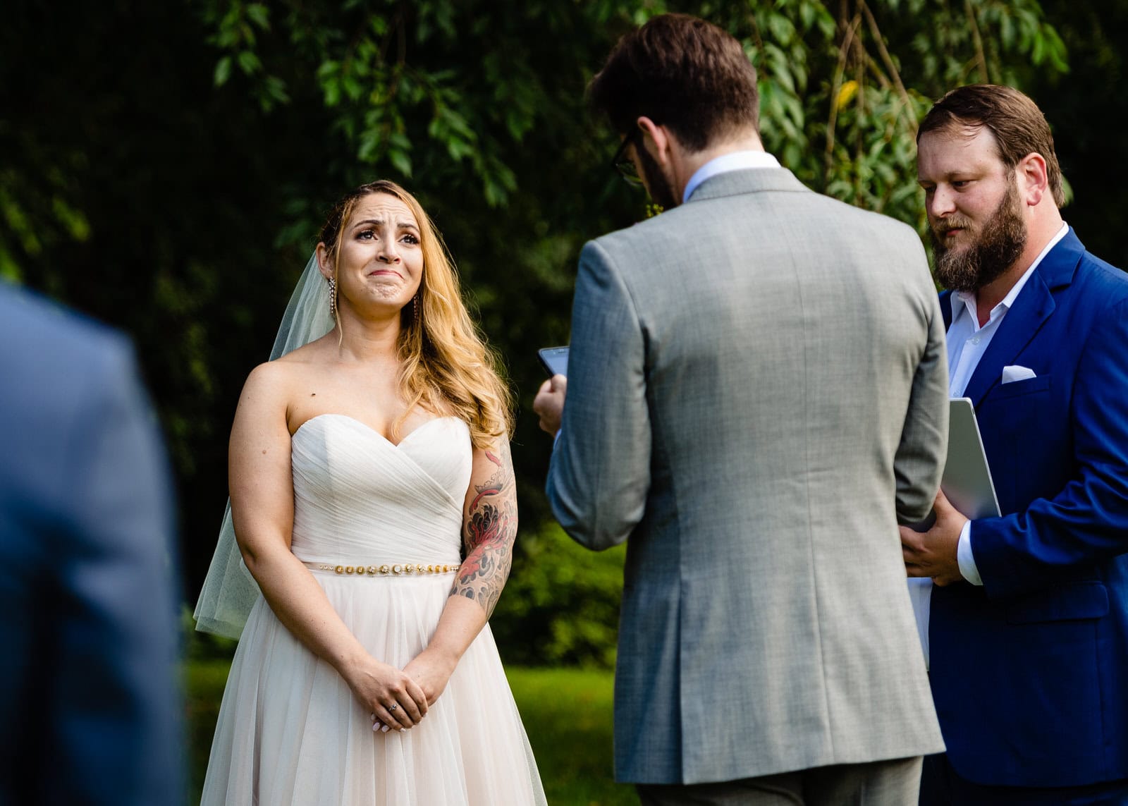 An emotional bride cries during the wedding ceremony