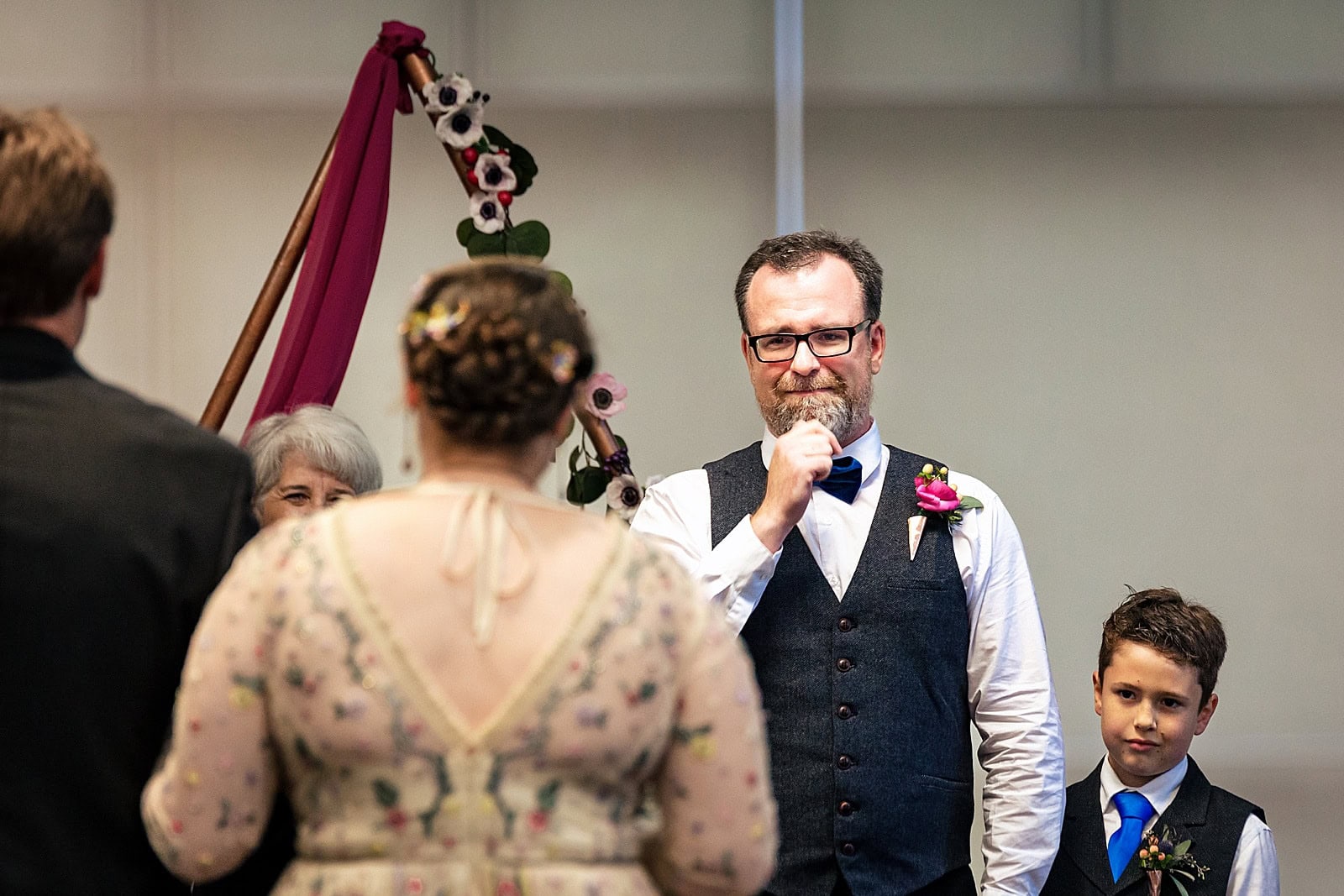 groom's emotional reaction the bride walking down the aisle