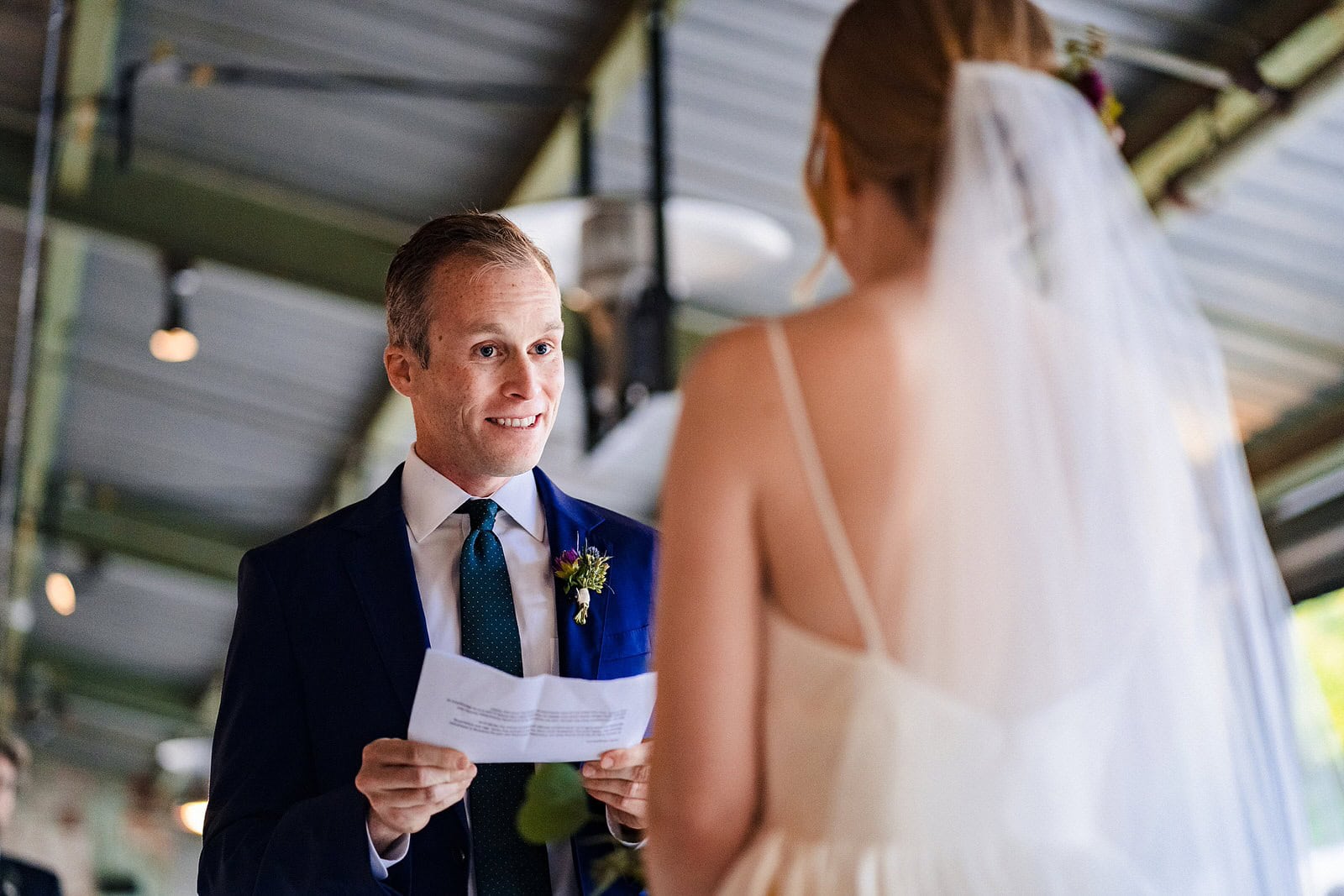 Couple exchanges personal vows during Belt Line Station wedding ceremony