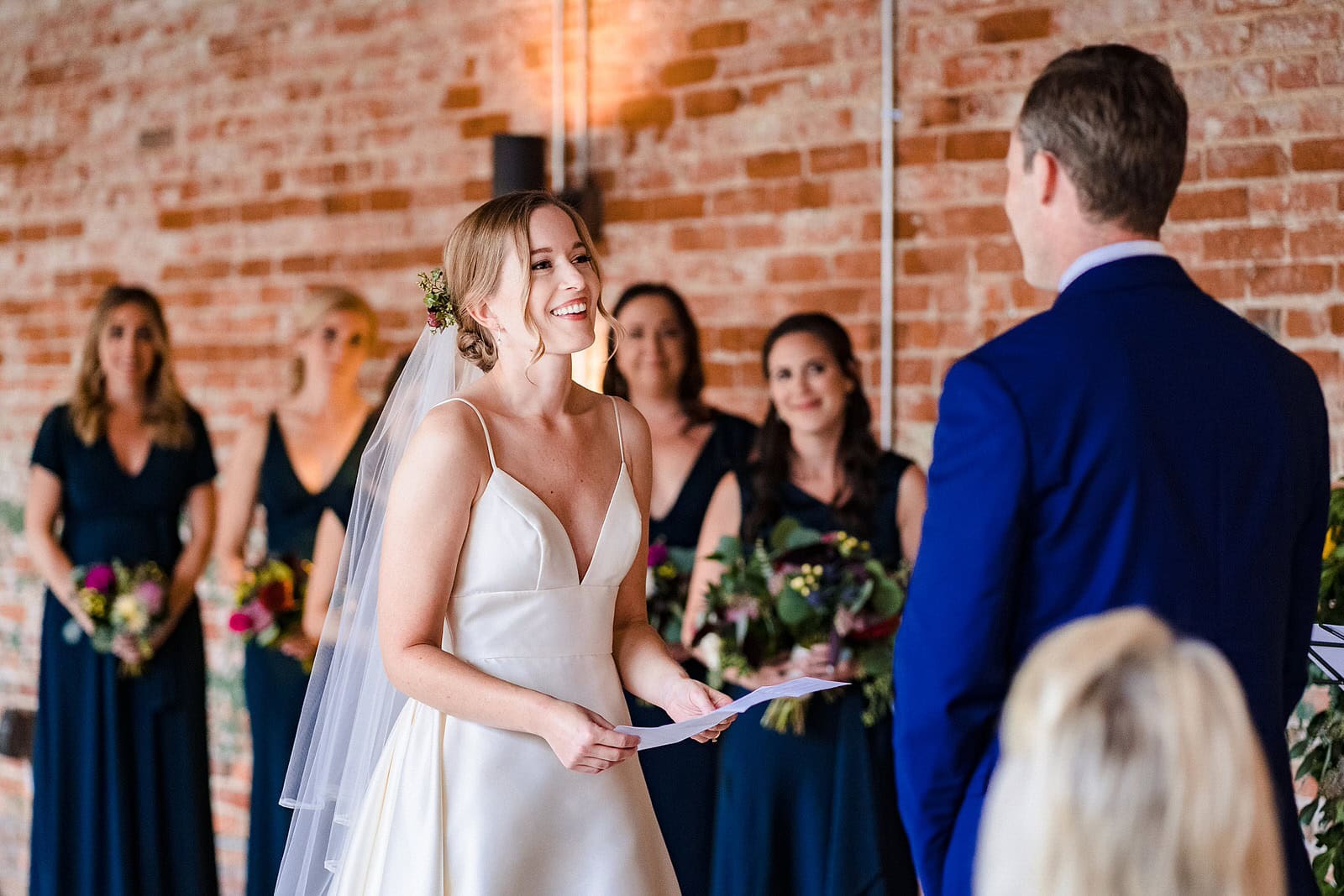 Couple exchanges personal vows during Belt Line Station wedding ceremony
