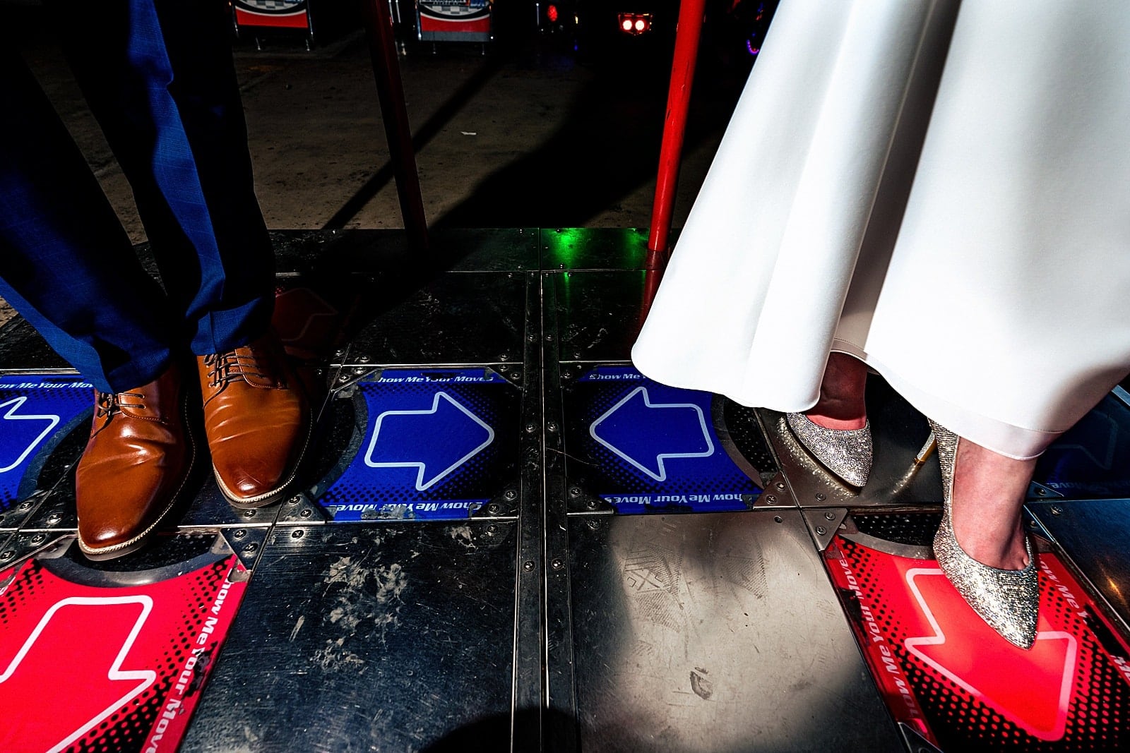 Bride and groom playing arcade games at a Boxcar Bar + Arcade wedding by Durham wedding photographers Kivus & Camera