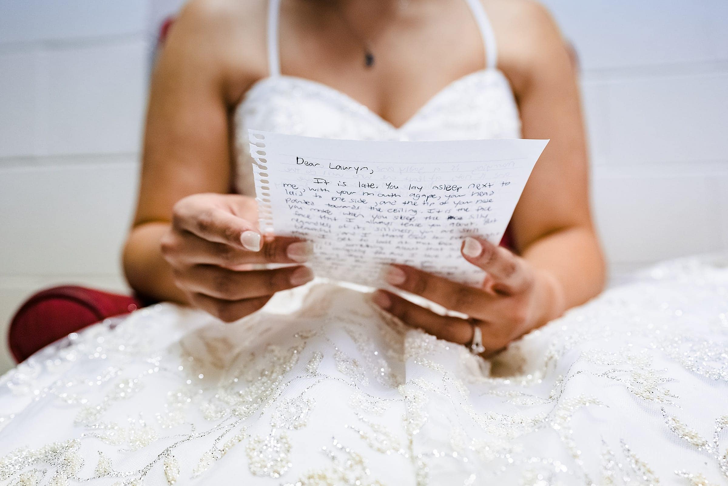 Bride reads a letter from the groom just before the ceremony | photos by Kivus & Camera