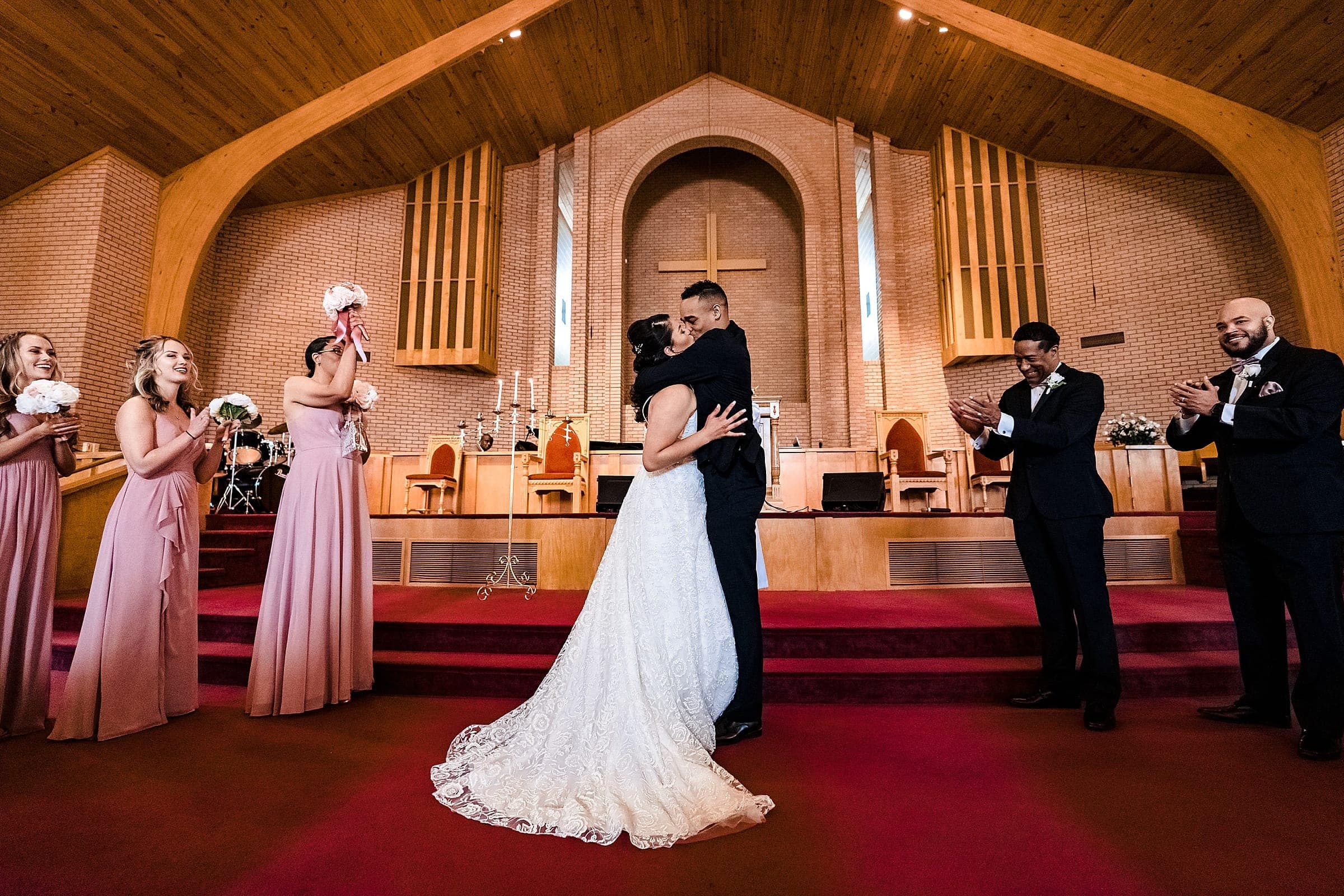 Couple shares first kiss at Mt Level Missionary Baptist Church in Durham, NC | photos by Kivus & Camera