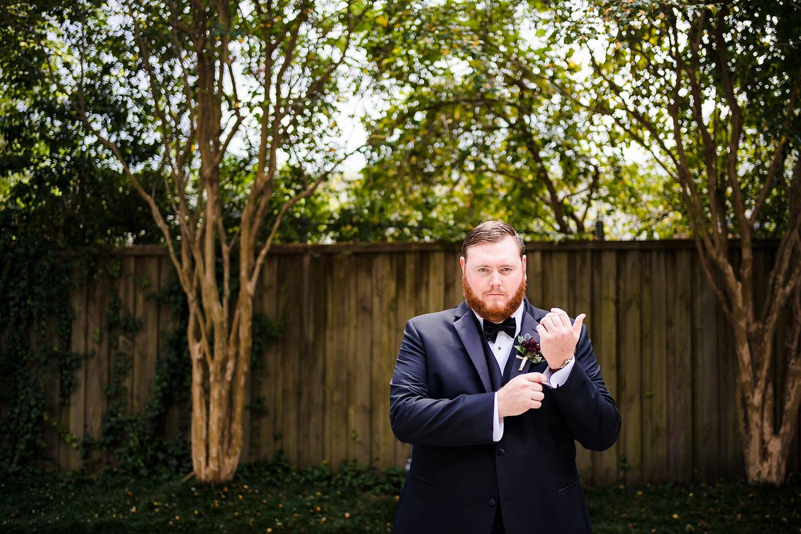 Groom poses for a portrait in the courtyard of the Brooklyn Arts Center