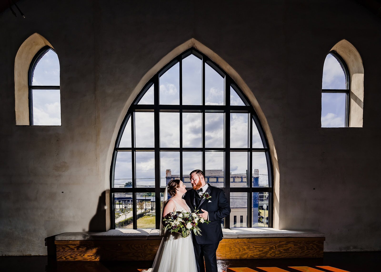 Portrait of a bride and groom on their wedding day at the Brooklyn Arts Center in Wilmington, NC