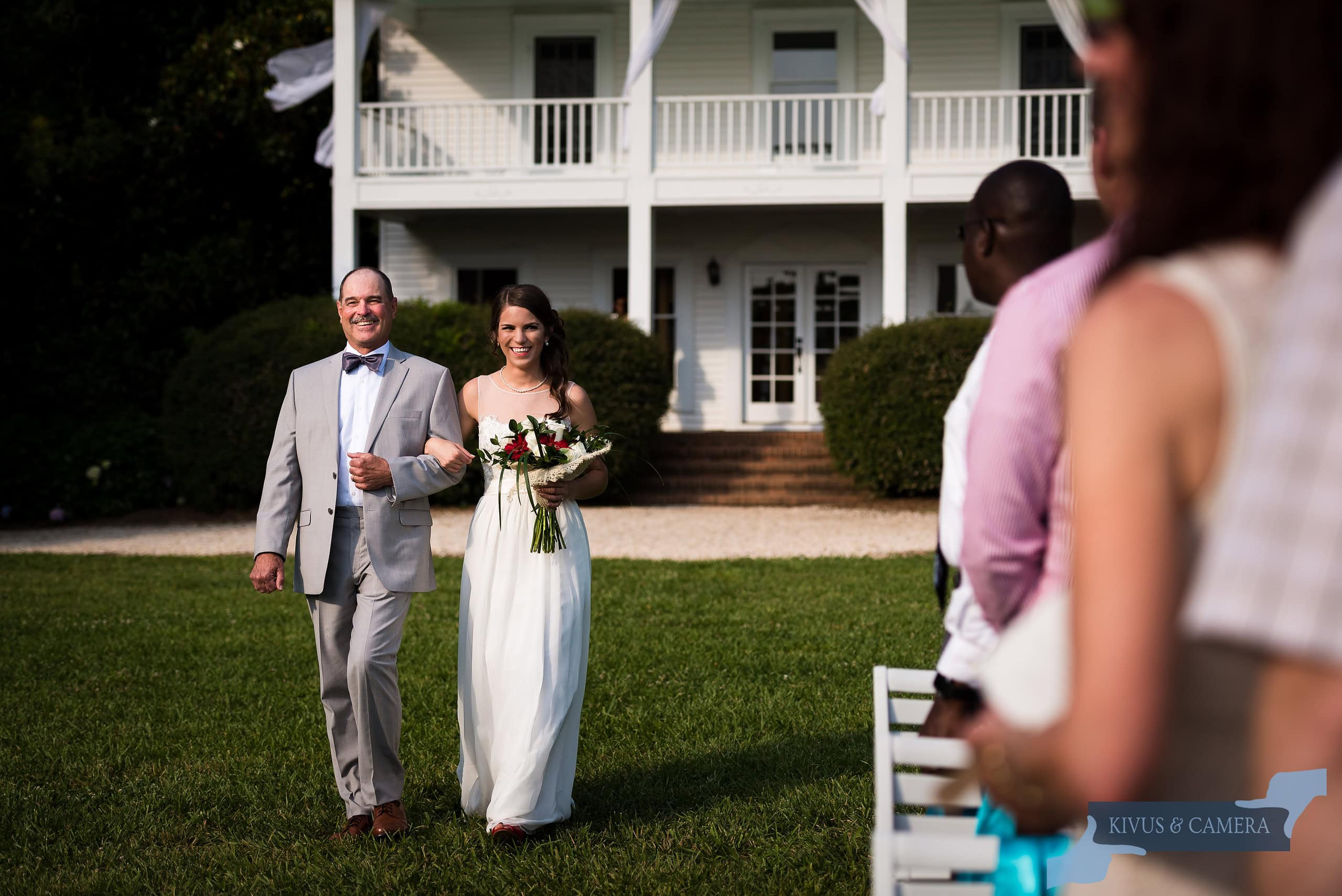 Father walking bride down aisle