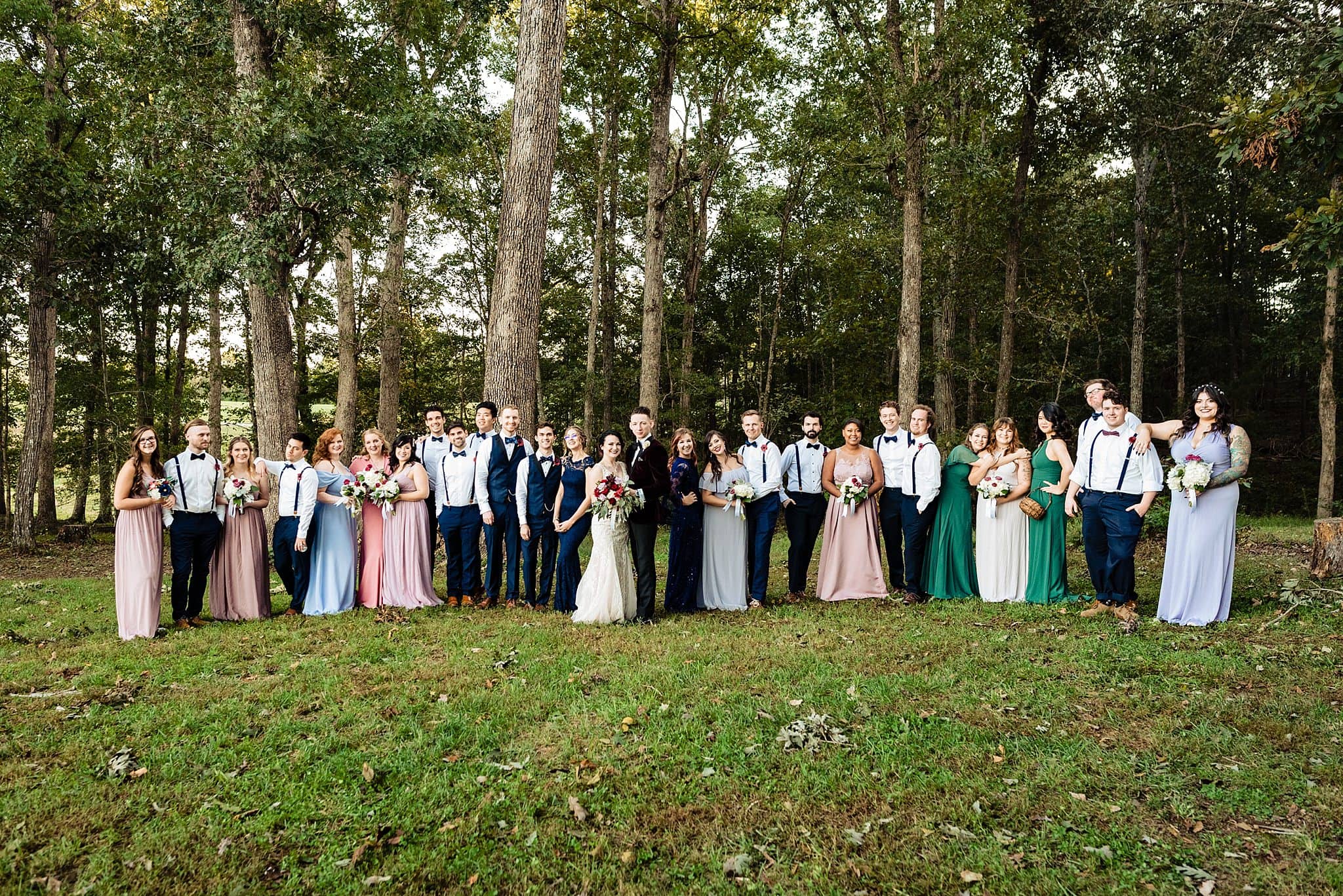 Mismatched bridesmaids dresses, large wedding party