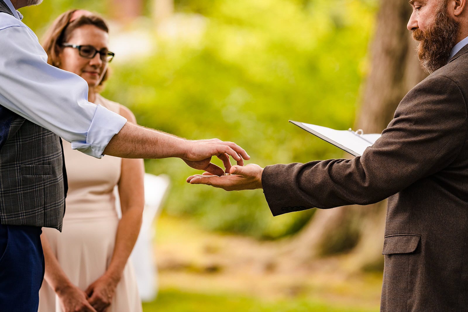 Wedding rings exchanged at small wedding ceremony