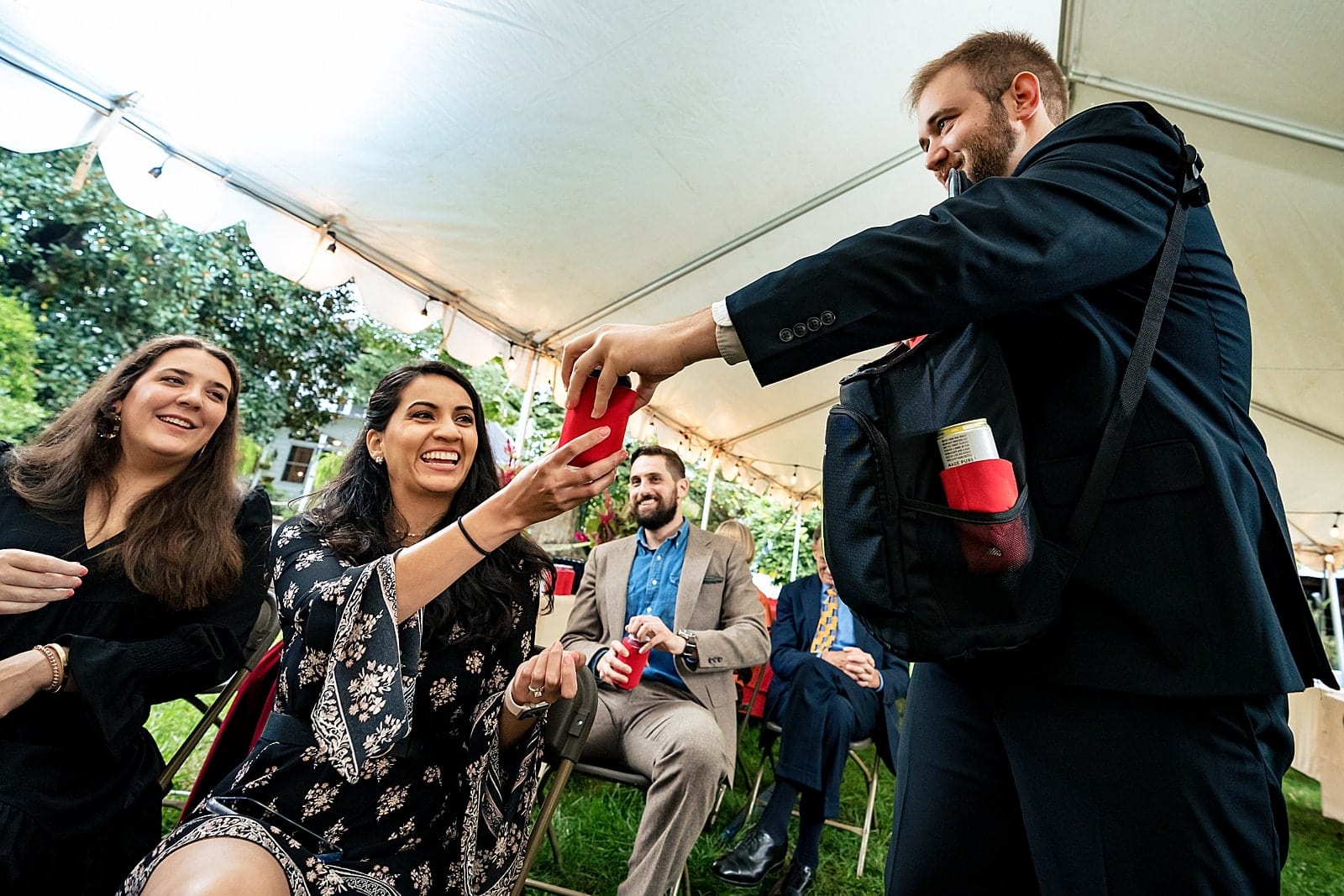 instead of a flower girl, this couple had the bride's younger brother pass out beers to everyone!!