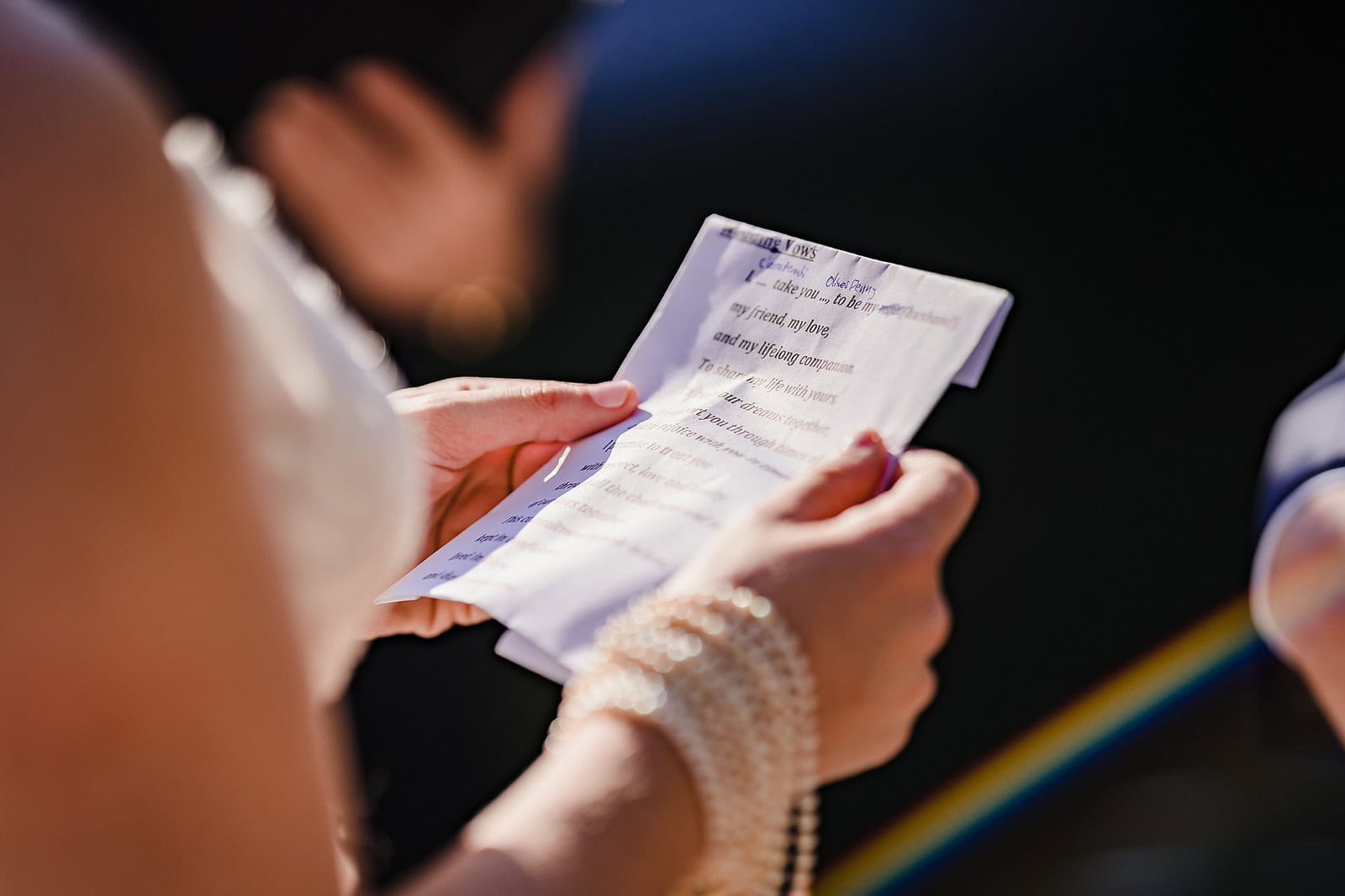 close up of the bride's hands holding her vows during a chapel hill elopement
