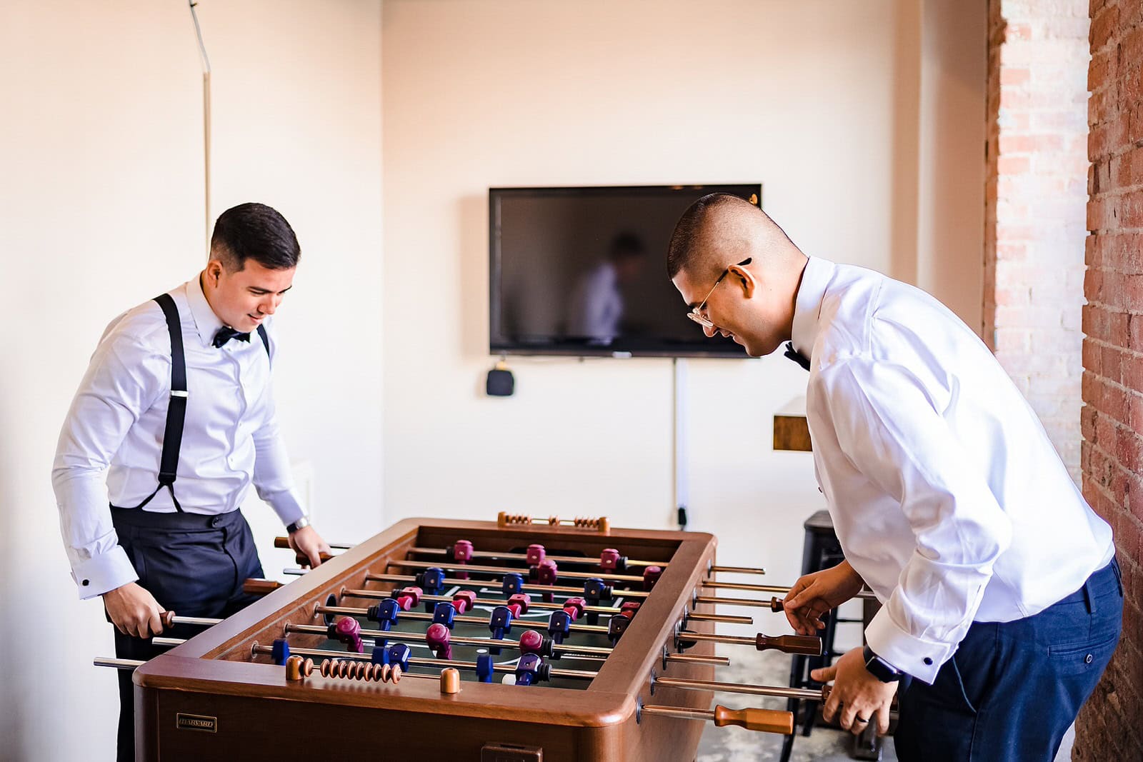 Groom gets ready at the Bull Durham Suite in Durham, NC