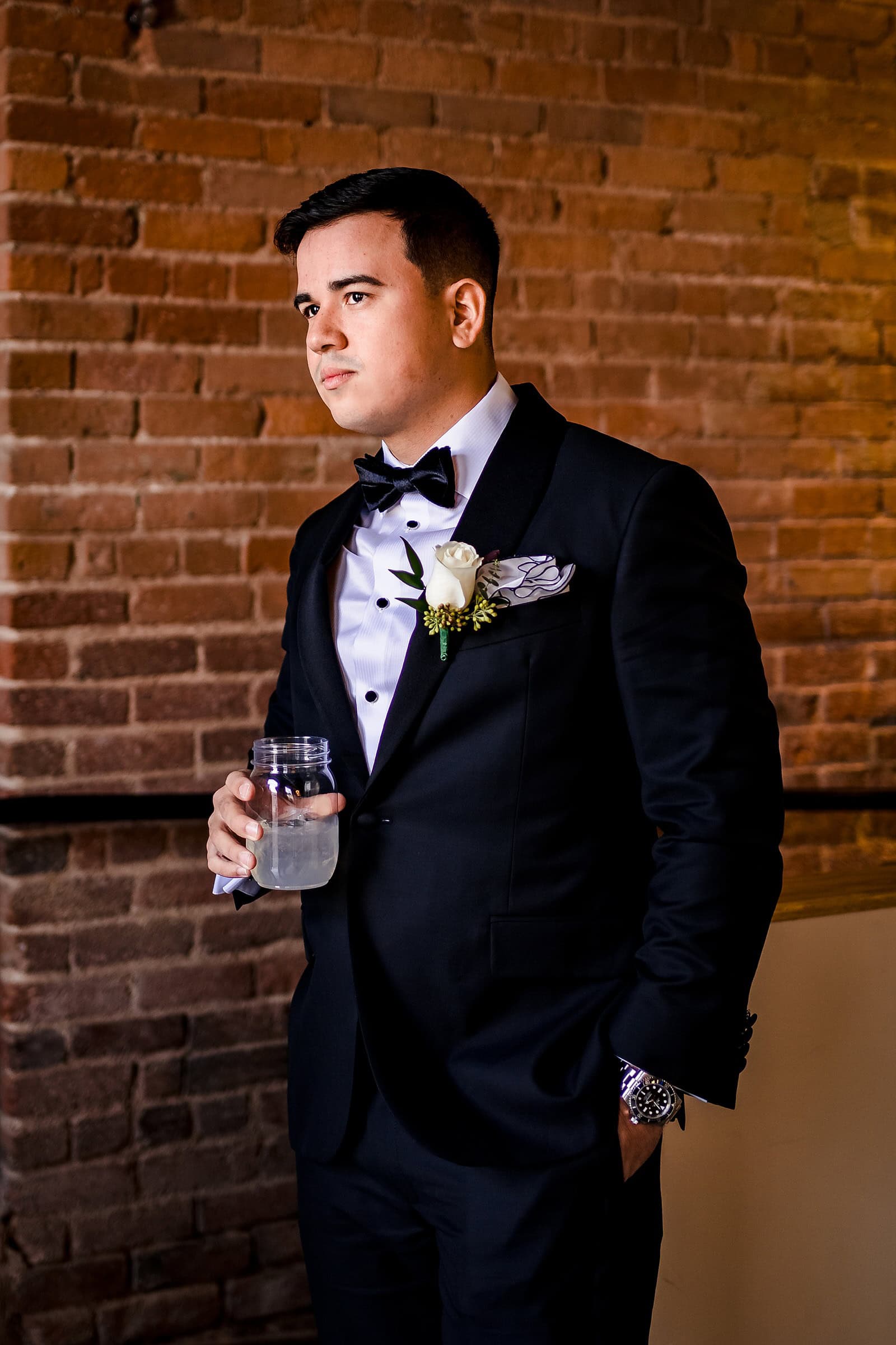 Groom gets ready at the Bull Durham Suite in Durham, NC