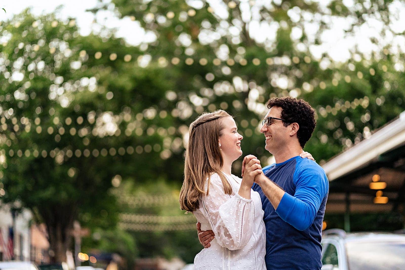 Raleigh engagement photos. With its cobblestone streets and string lights, City Market in downtown Raleigh makes for a great engagement session location