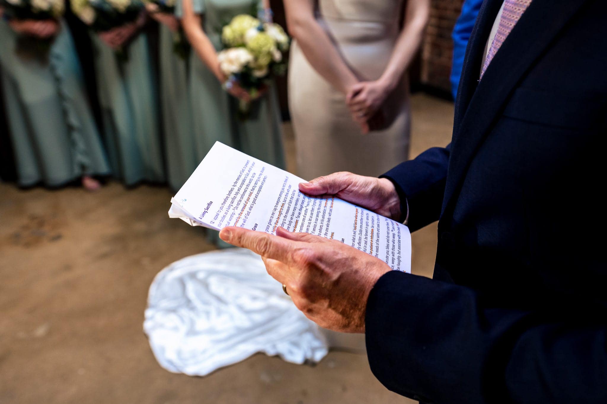 brother of the groom gives a reading during indoor wedding ceremony at The Grove at City Market | photo by Kivus & Camera