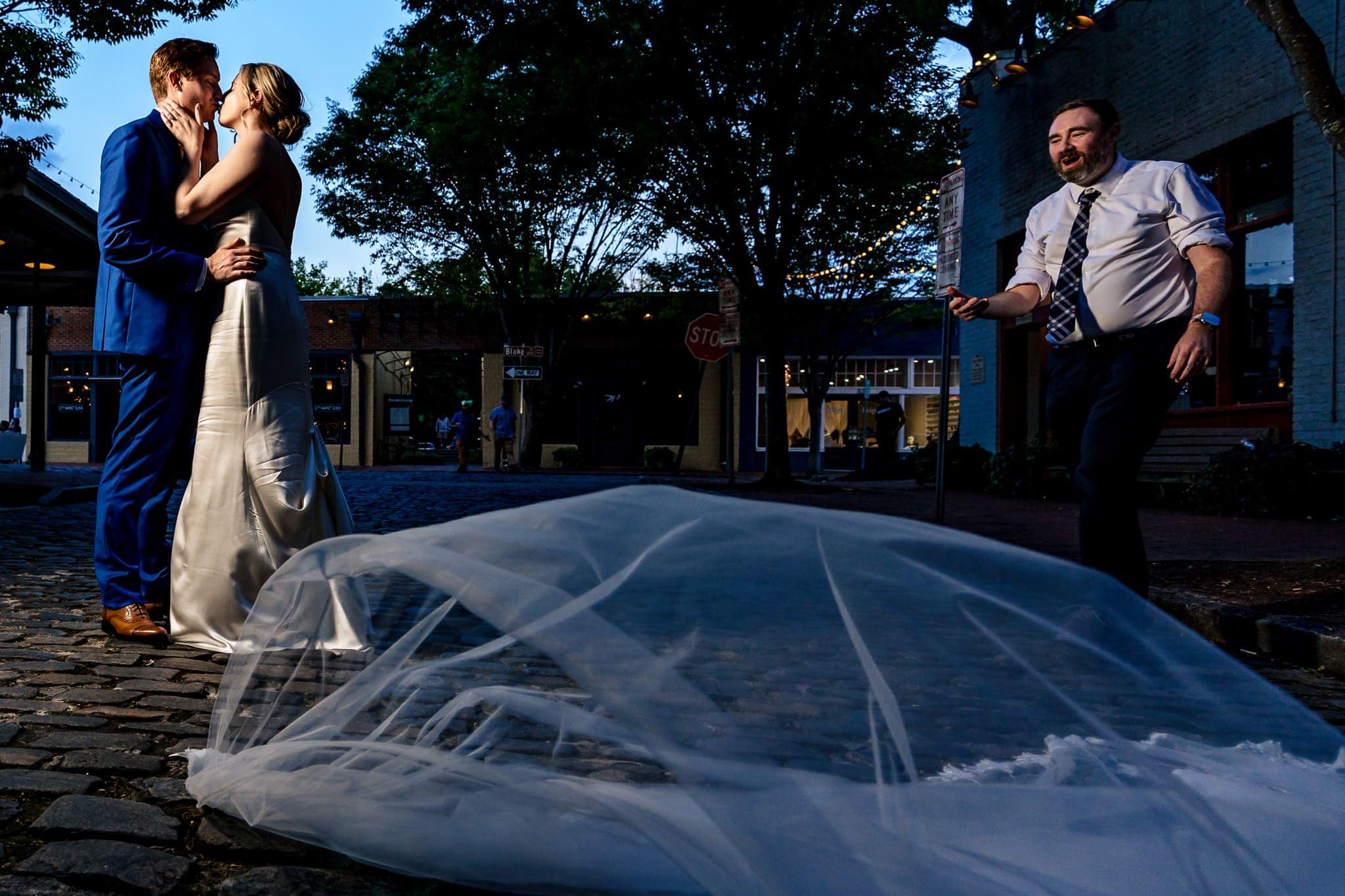 outtake from a wedding day: instead of blowing in the wind behind her, the bride's veil blew right out of her hair | photo by Kivus & Camera