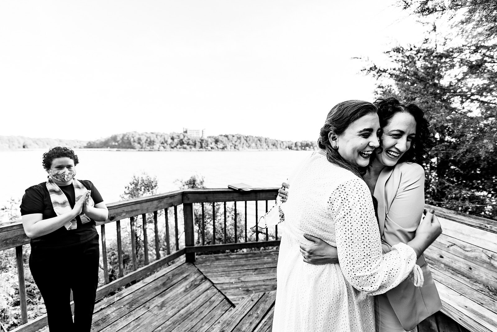 Two brides embrace immediately after their intimate wedding ceremony in Raleigh, NC