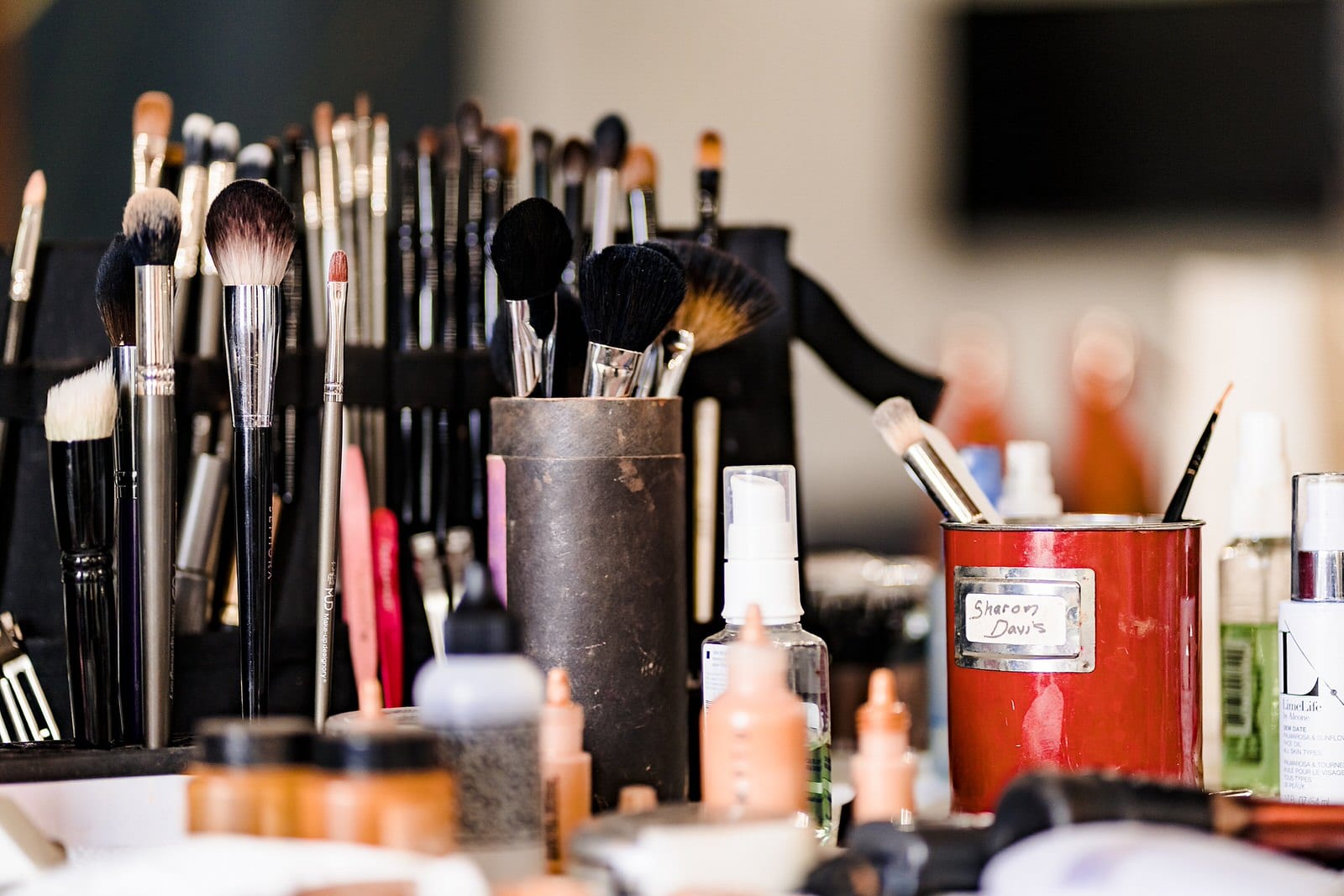 Sharon Davis Makeup Artistry has a table set full of brushes