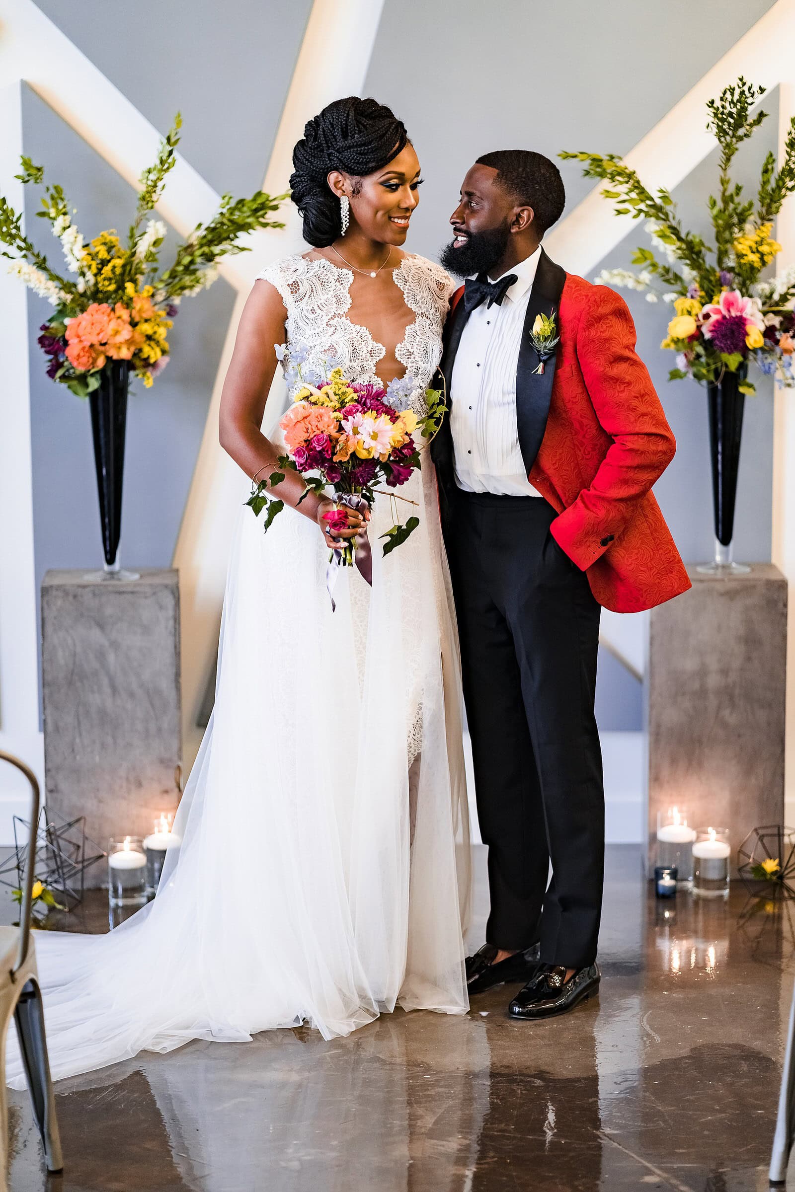 Woman in a Gavin Christianson gown and man in a Robert Jamison Collection custom suit pose for a wedding portrait