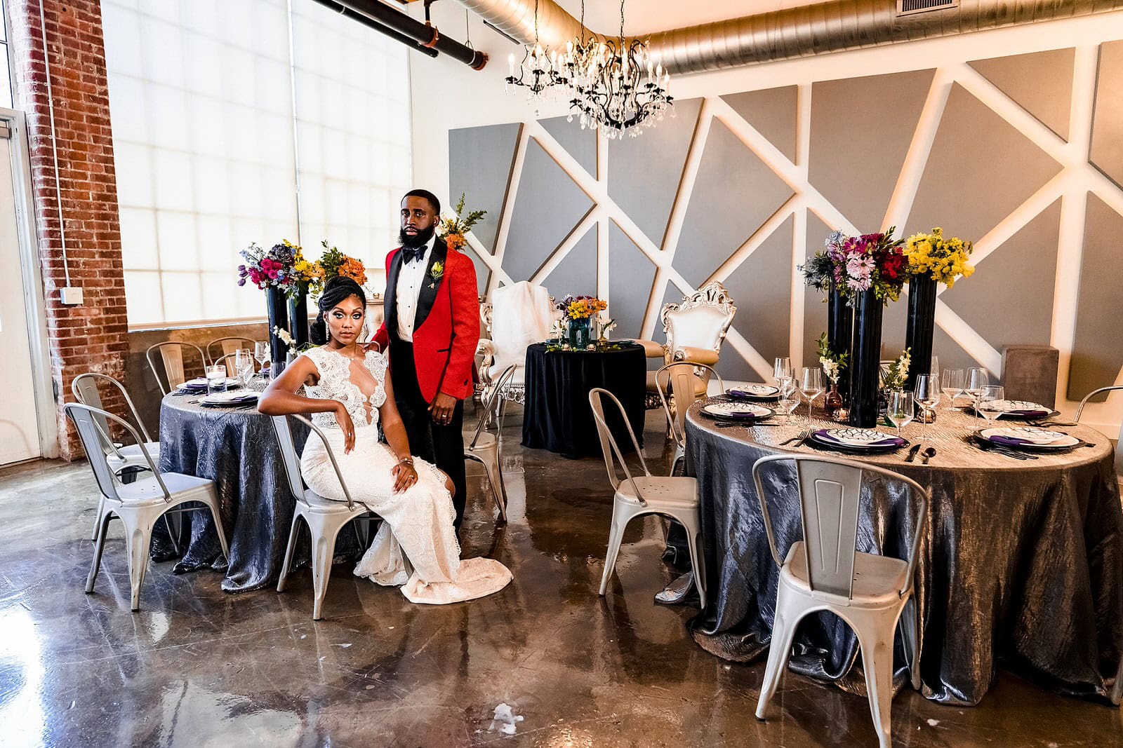 Bride and groom sit in their reception area at the Lucky Strike Suite