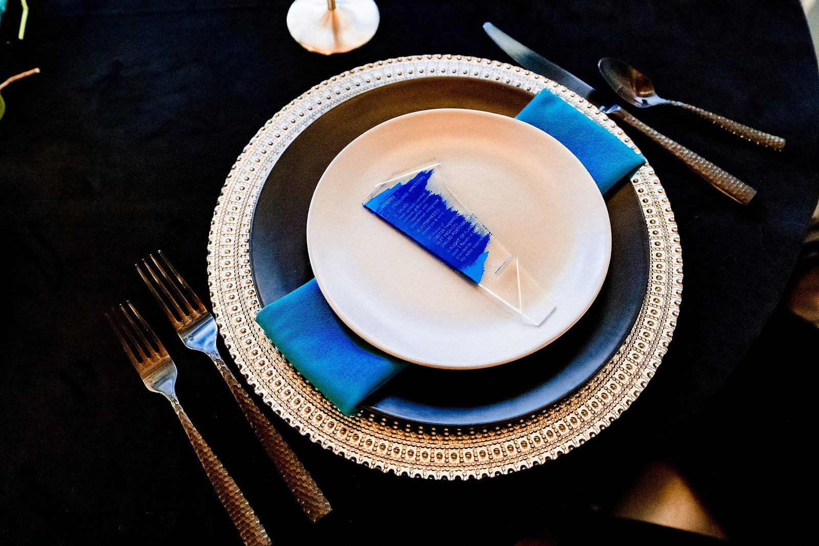 closeup of menu on a wedding place setting