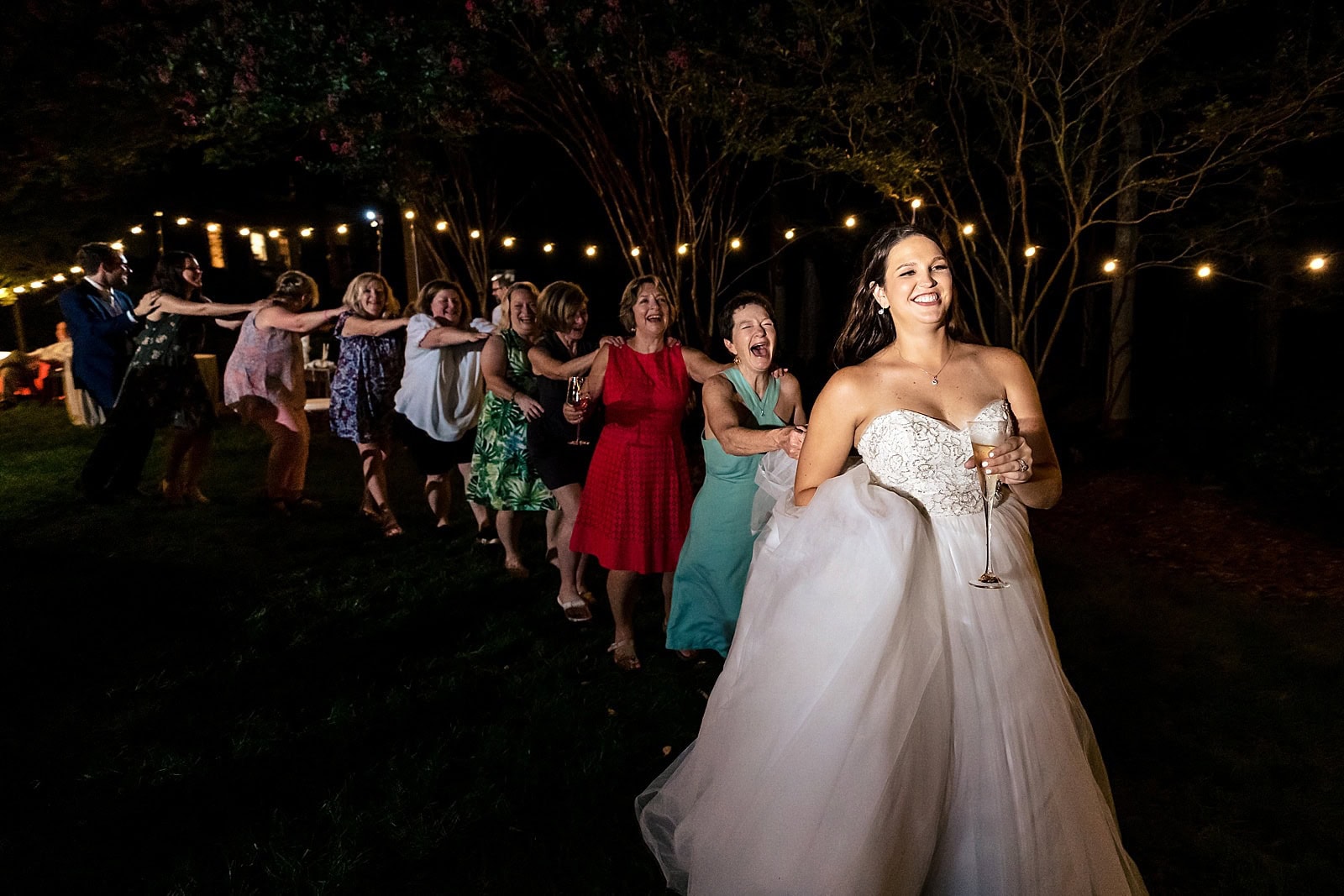 If you're having an al fresco wedding reception, make sure you get a photographer who knows how to light up the dark