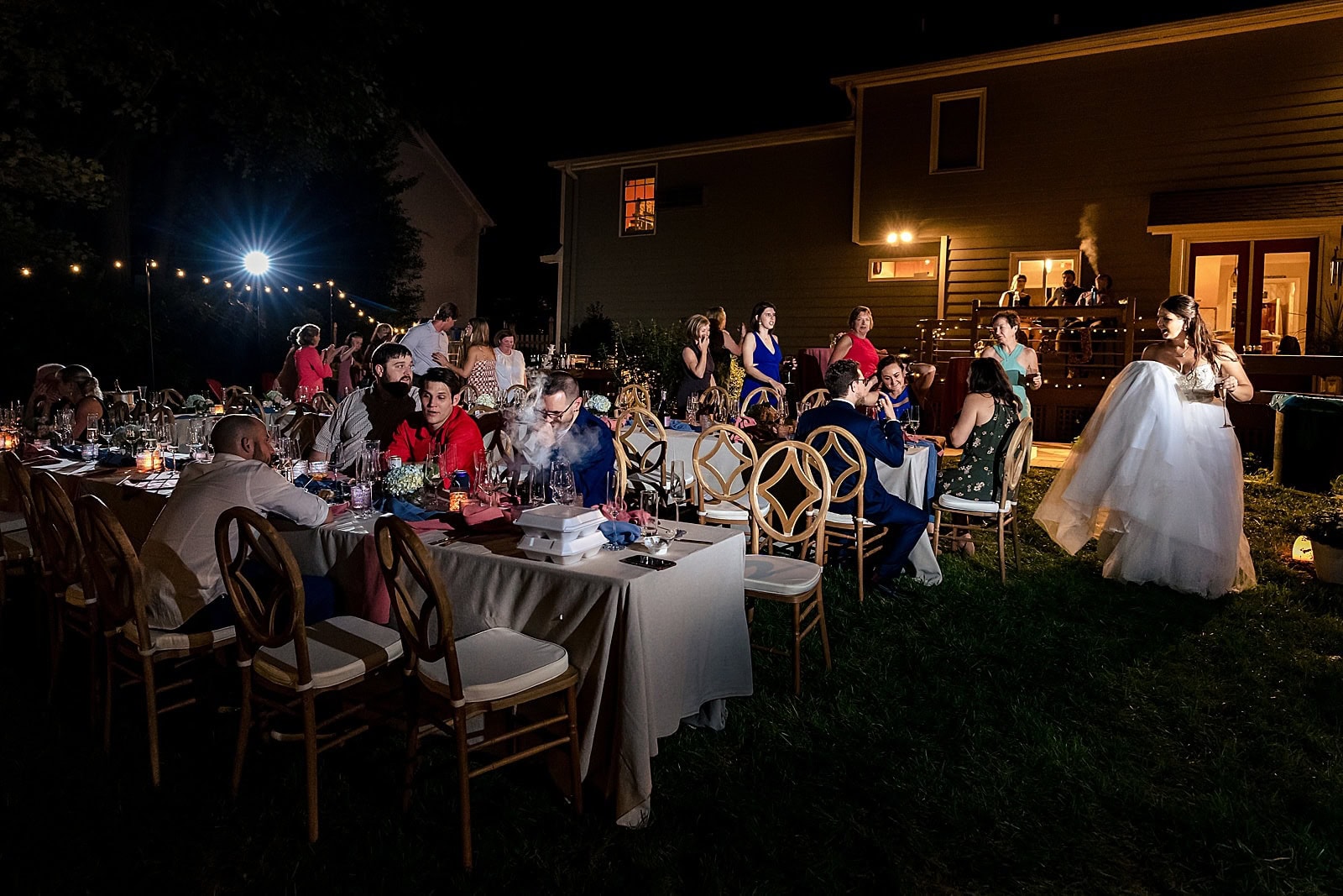 If you're having an al fresco wedding reception, make sure you get a photographer who knows how to light up the dark