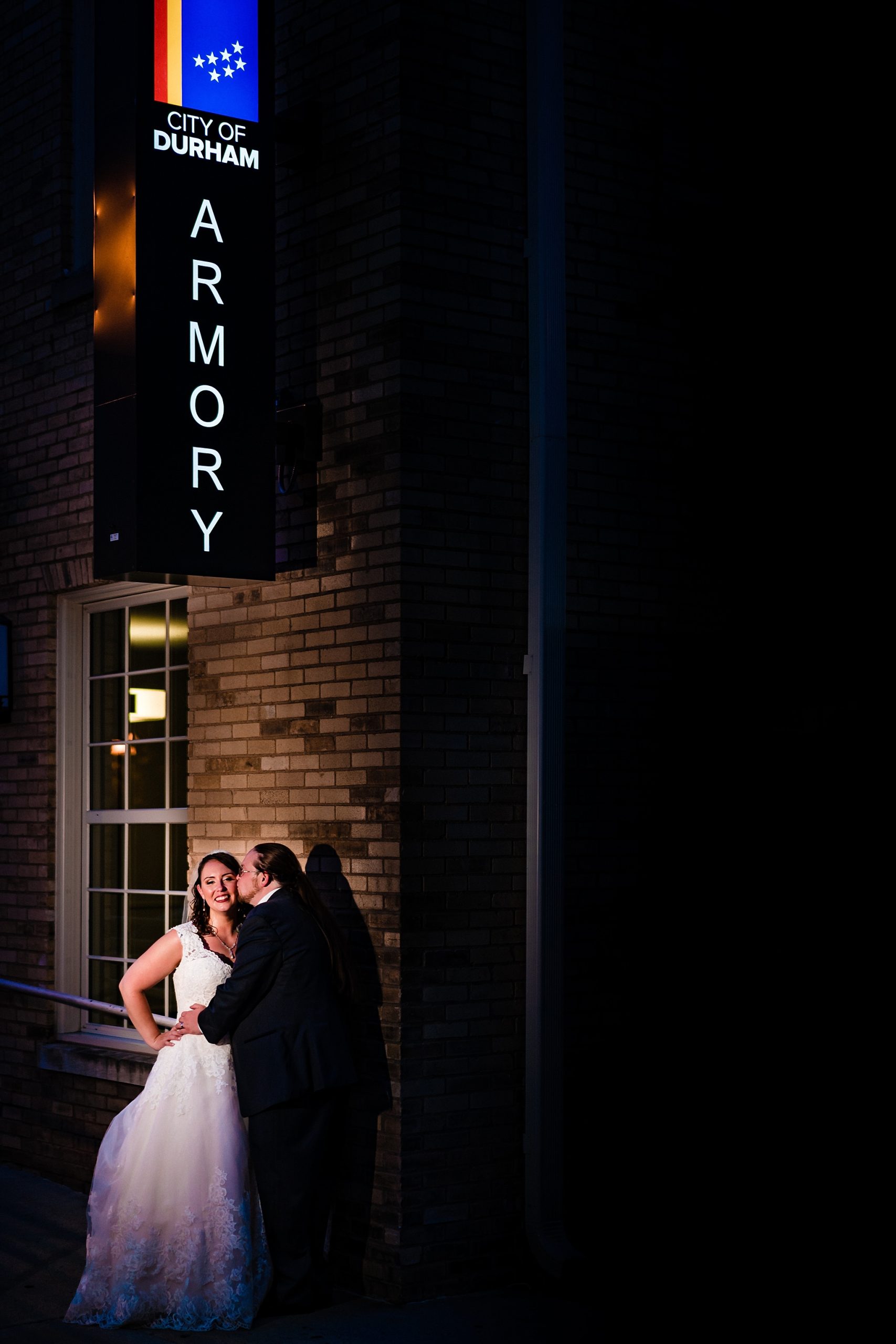 Portraits of a bride and groom in downtown Durham, taken by Raleigh wedding photographers during their Durham Armory wedding
