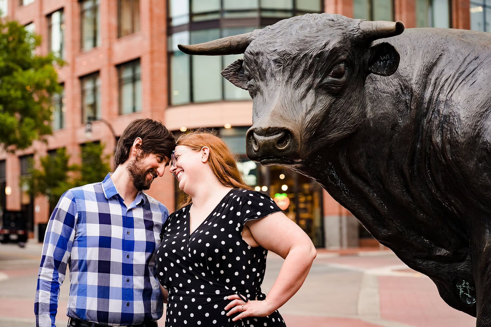 Engagement photos in downtown Durham with Major the Bull