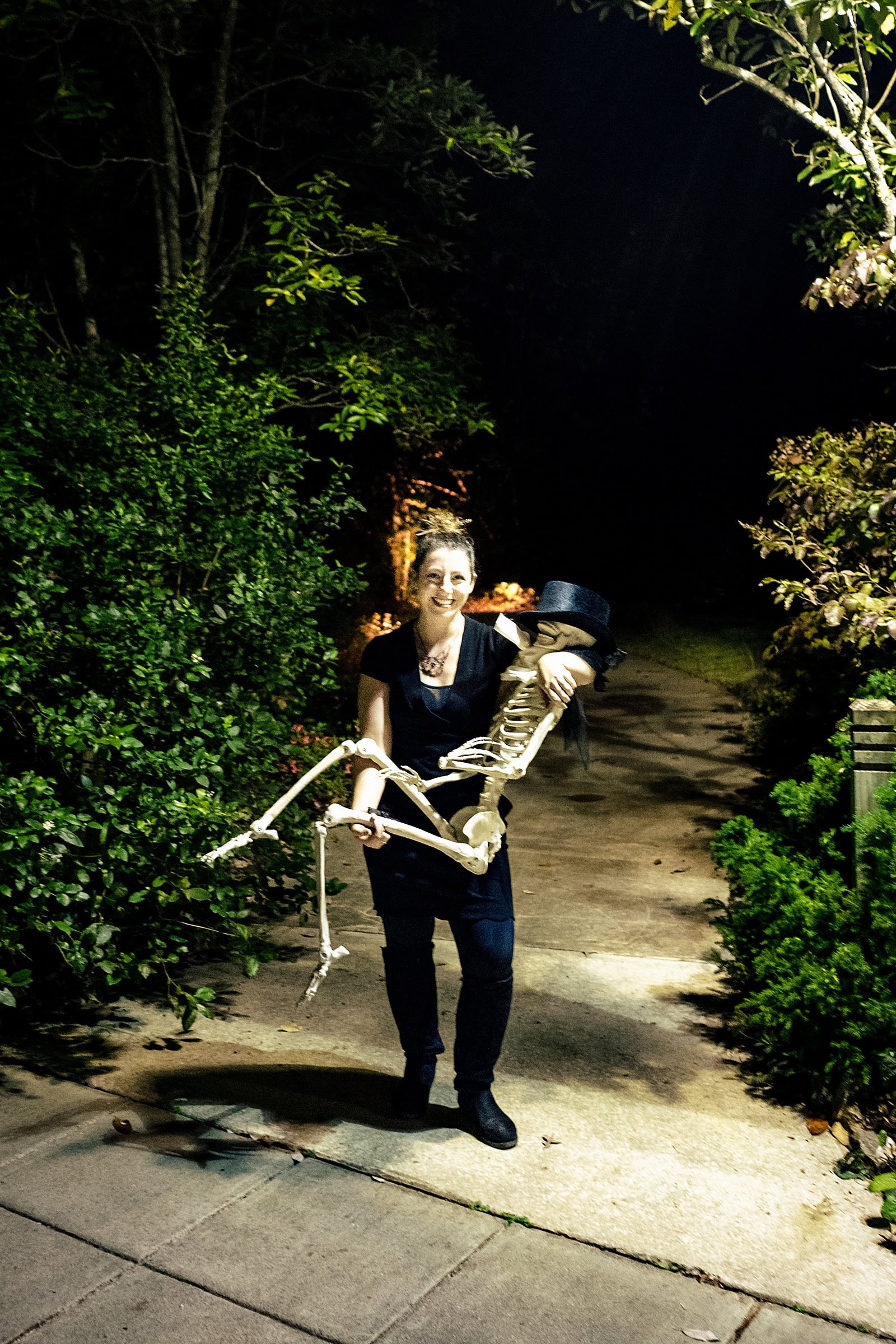 Stephanie from Beauty and the Budget Events helps get a Halloween wedding prop in place at this Edgar Allan Poe themed same sex wedding.