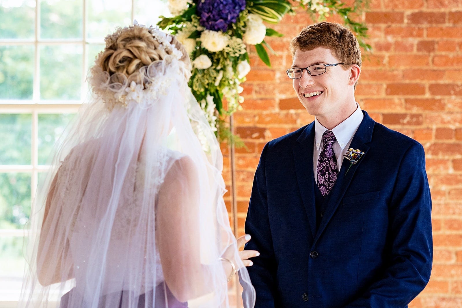 Bride and groom share a first look at The Cotton Room in Durham, NC