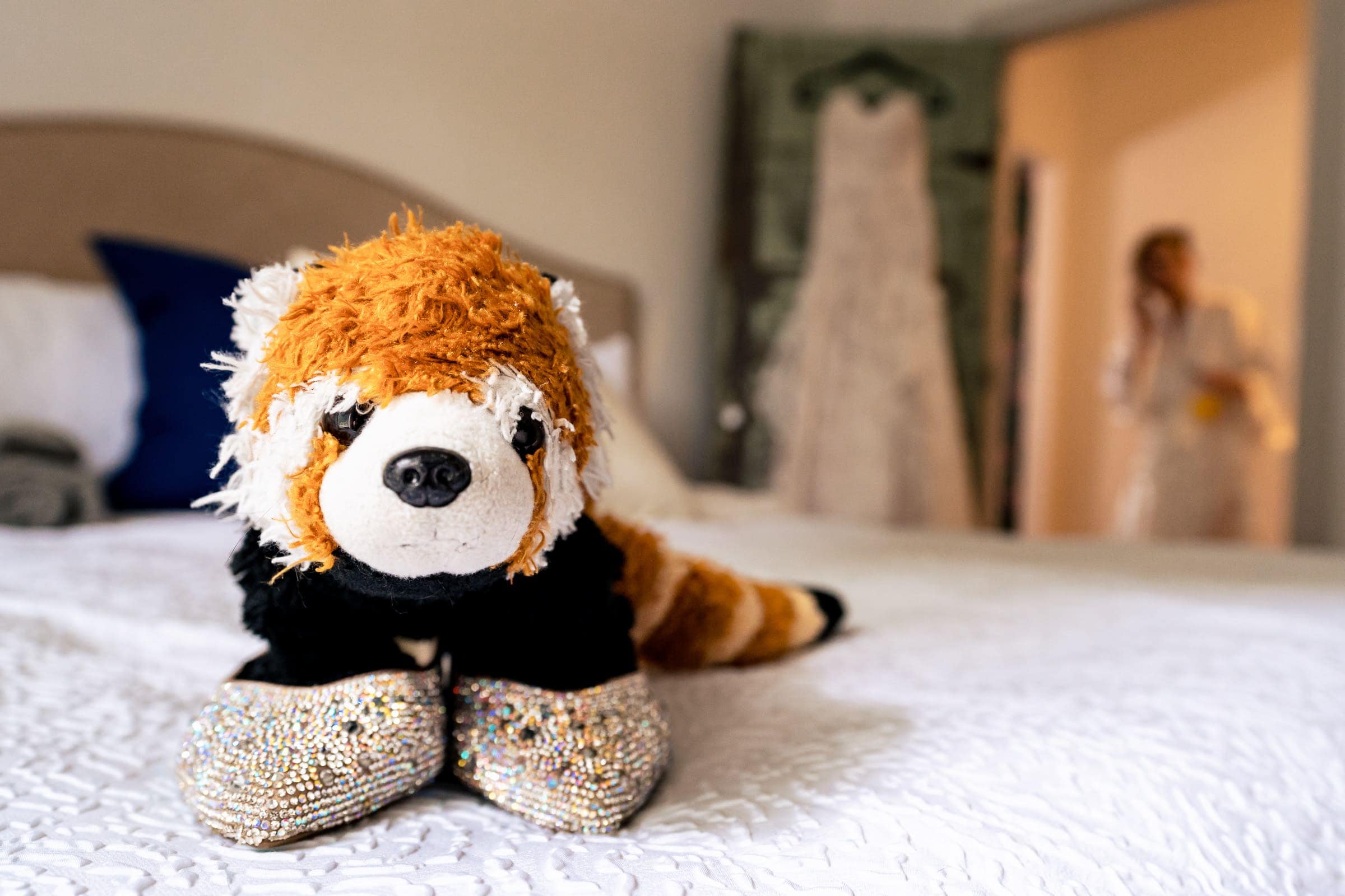 this bride had her stuffed red panda in the room where she was getting ready. I photographed her little friend in her shoes as a fun surprise | Kivus & Camera