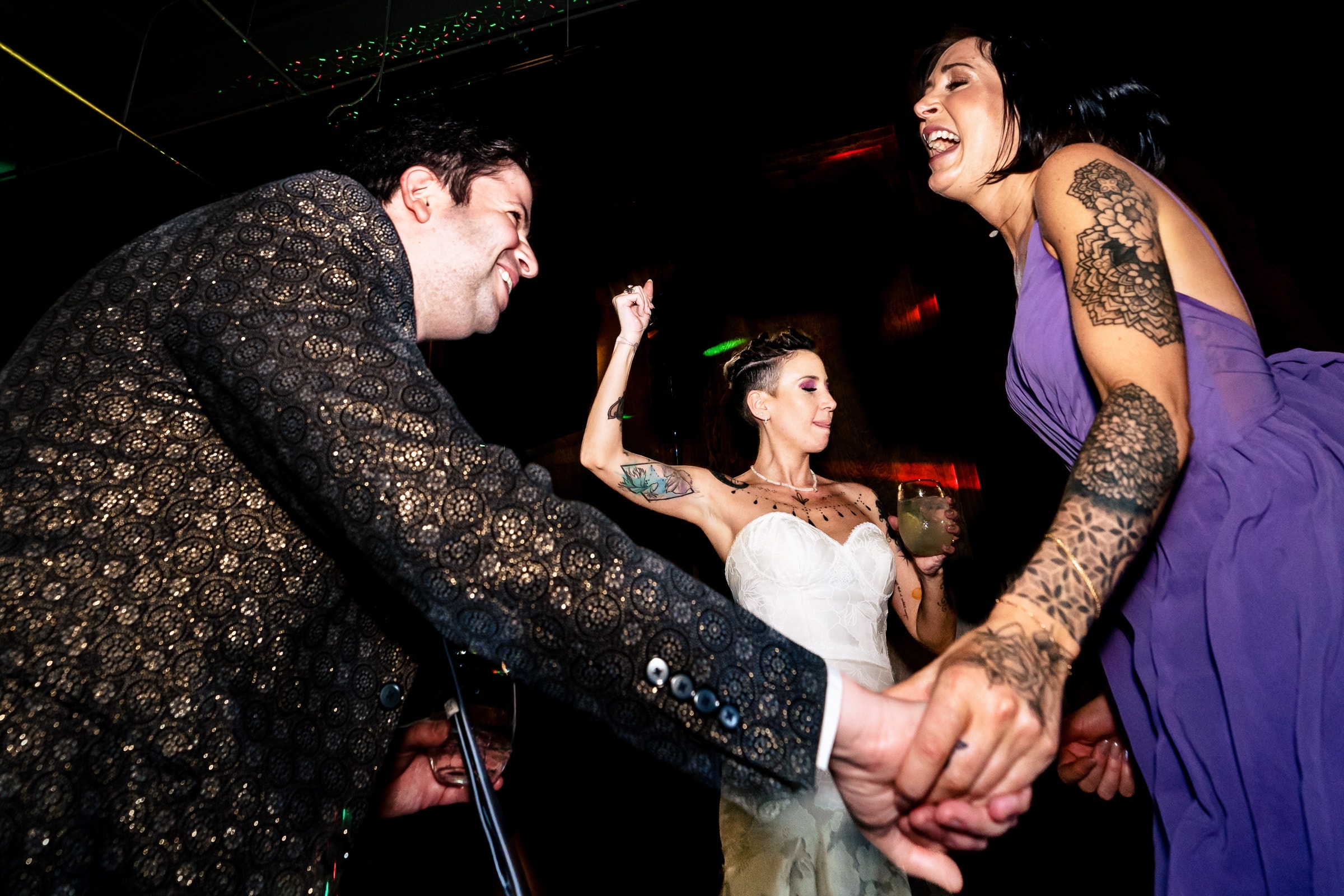 Bride wearing heart shaped white sunglasses at her wedding reception | Kivus & Camera